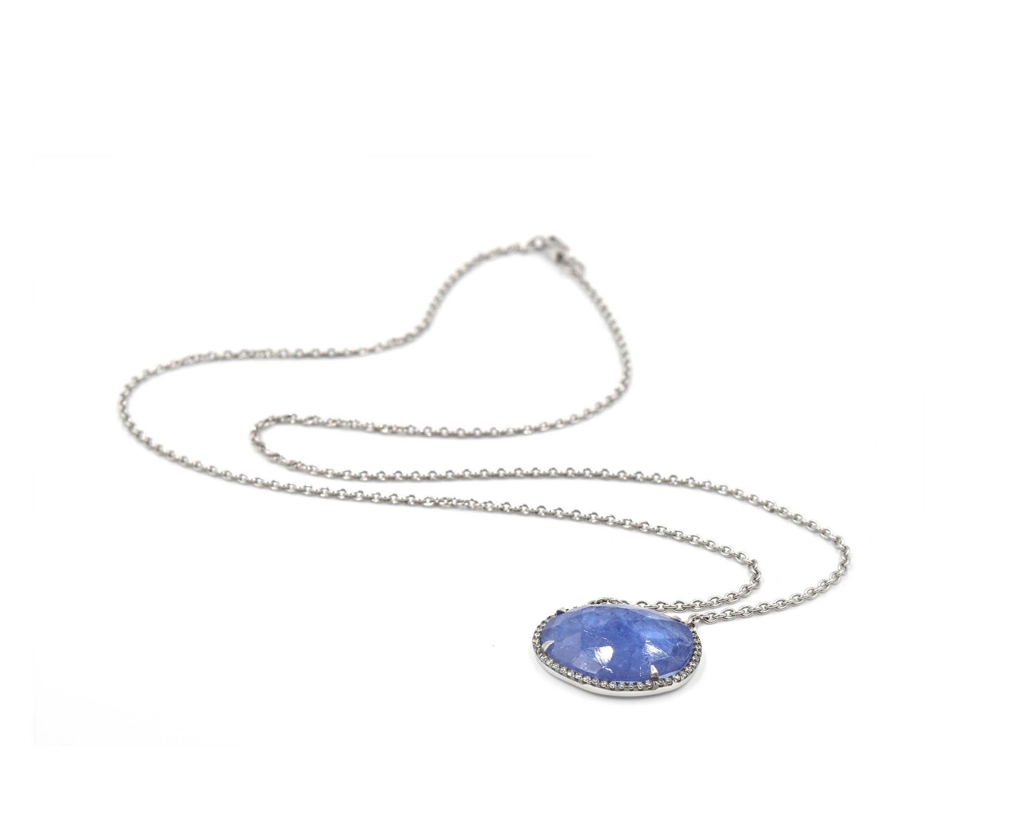 Designer: custom design
Material: 18k white gold
Tanzanite: one cabochon faceted tanzanite 8.94 carat weight
Diamonds: 0.19 carat weight
Color: G-H
Clarity: SI
Dimensions: necklace is 17-inch long
Weight: 6.2 grams
