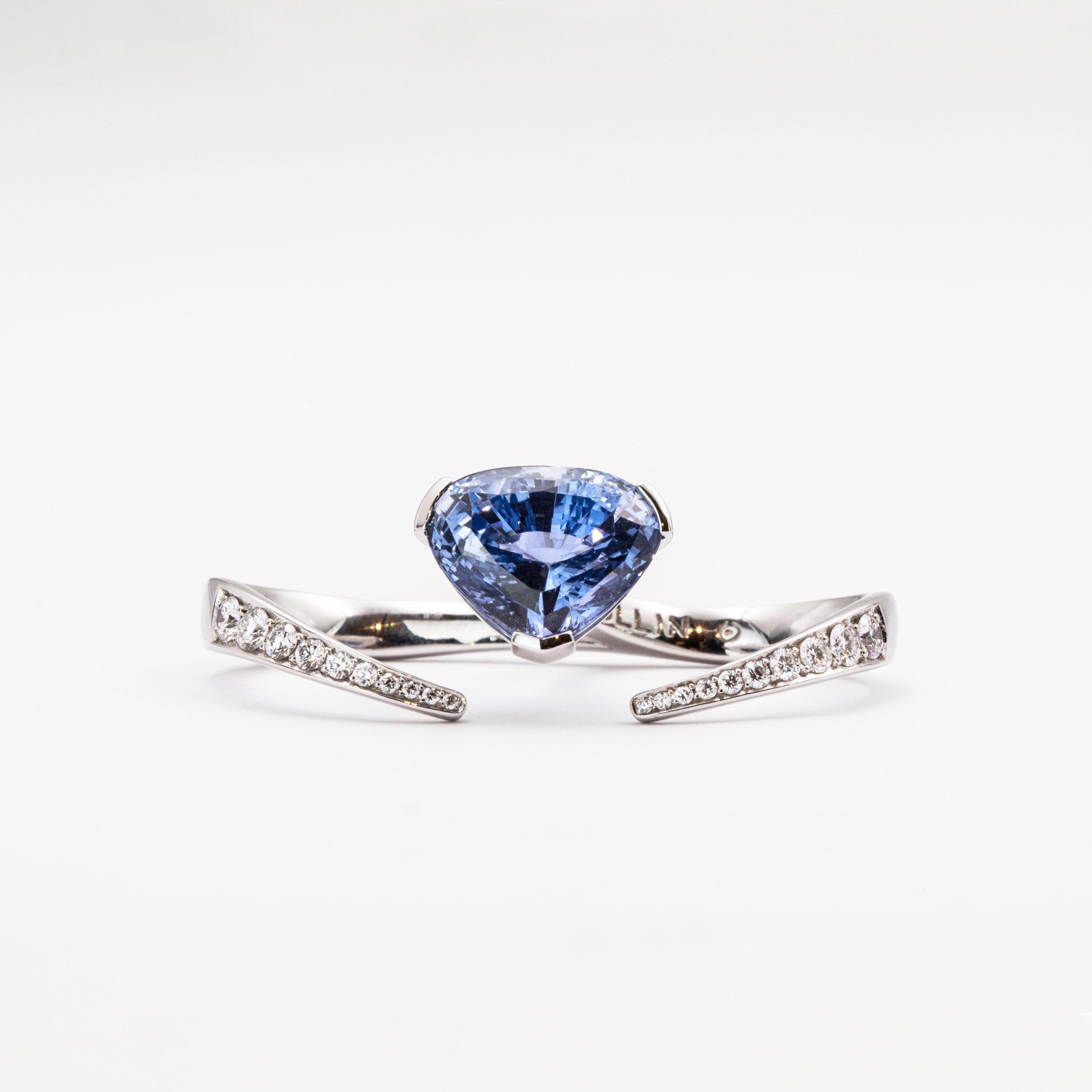 The diamond-set shank of this piece, covering the middle as well as the ring finger, features a pear-shaped blue sapphire weighing 8.97 carats. The ring bears a total of 0.49 carat white diamonds (F / VVS) and is hand-crafted in 18 carat white gold.