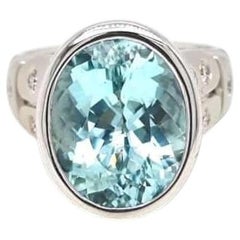 Anillo con turmalina Paraíba de 8,98 ct, de color azul verdoso neón intenso, en oro de 18 quilates, con certificado GIA.