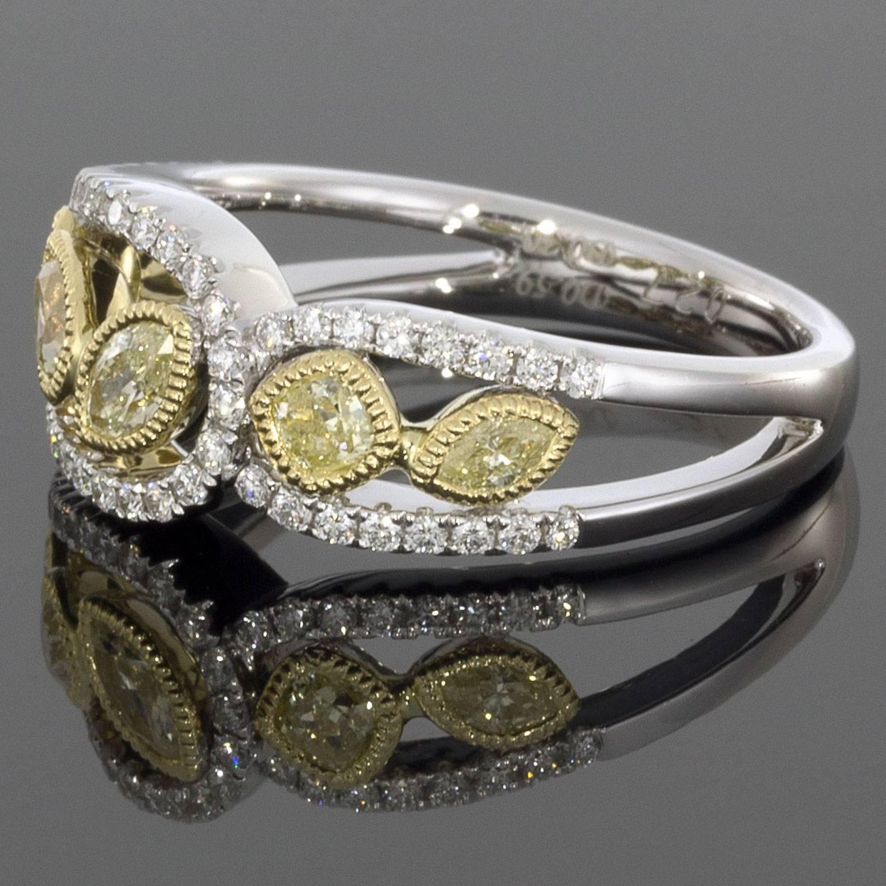 This beautiful ring is made of yellow & white diamonds and set in yellow & white gold.  The diamonds are marquise, cushion and pear-shaped to create a captivating leaf like design of diamonds dancing across your finger.

DETAILS:
.89CTW Diamond