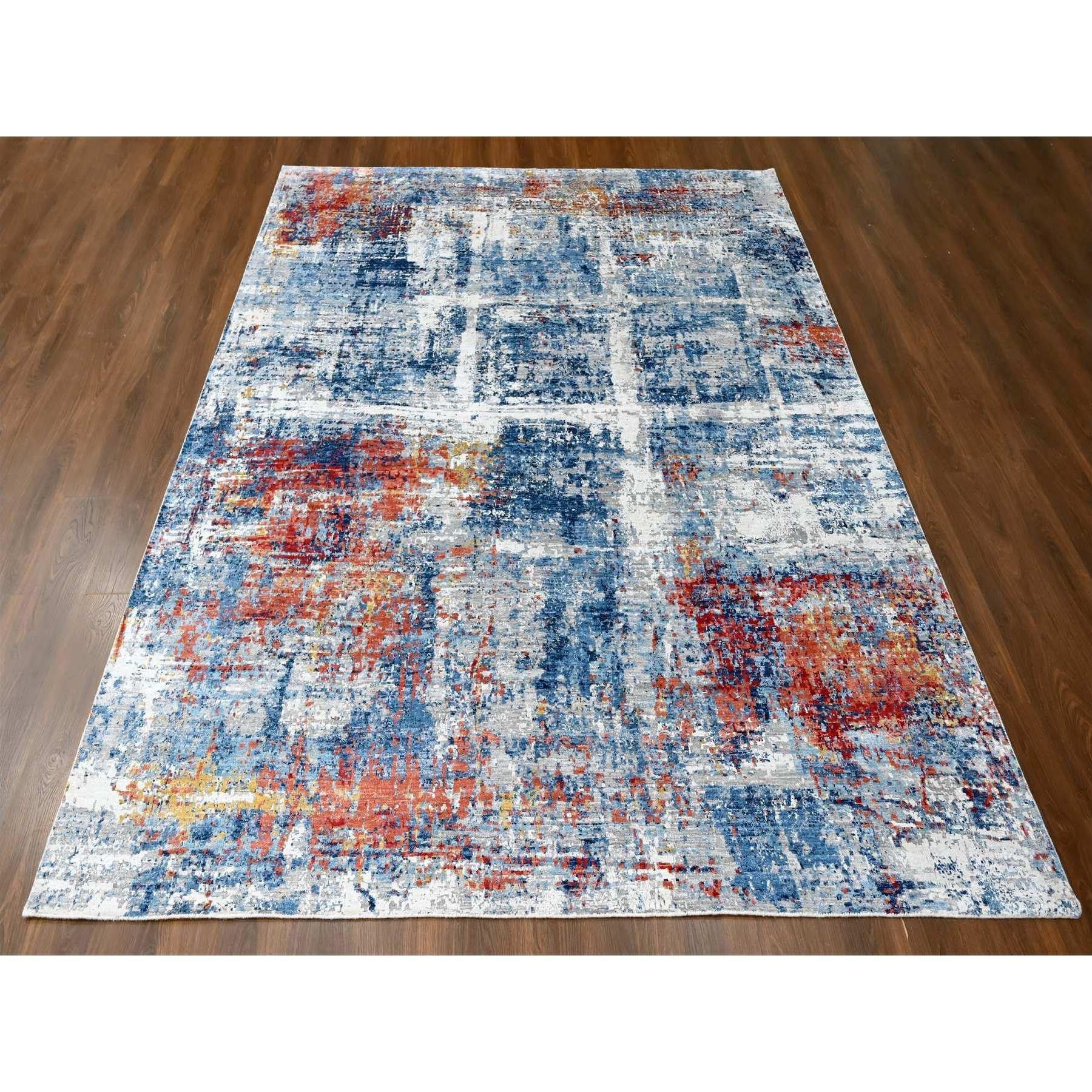 Azul imperial y colores tierra, diseño abstracto con tejido nepalí, seda brillante de origen vegetal, anudada a mano, alfombra oriental
Materiales primarios: Seda
Látex: Sin pelo 
altura: 0,25 Pulgadas
Estilo: Contemporáneo
Color principal: