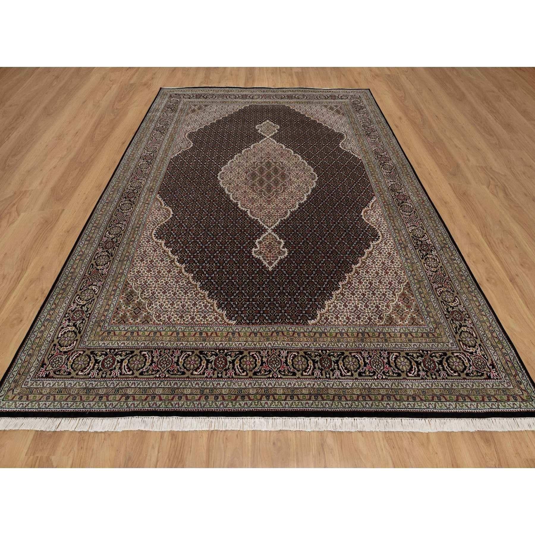 Jade Black, 100% Wool, Tabriz Mahi with Fish Medallion Design, Hand Knotted, 175 KPSI, Oriental Rug
Primary materials: Wool
Latex: No Pile 
height: 0.25 Inches
Style: Traditional
Primary color: Black
Secondary colors: Brown, Red, Ivory, Green, Light