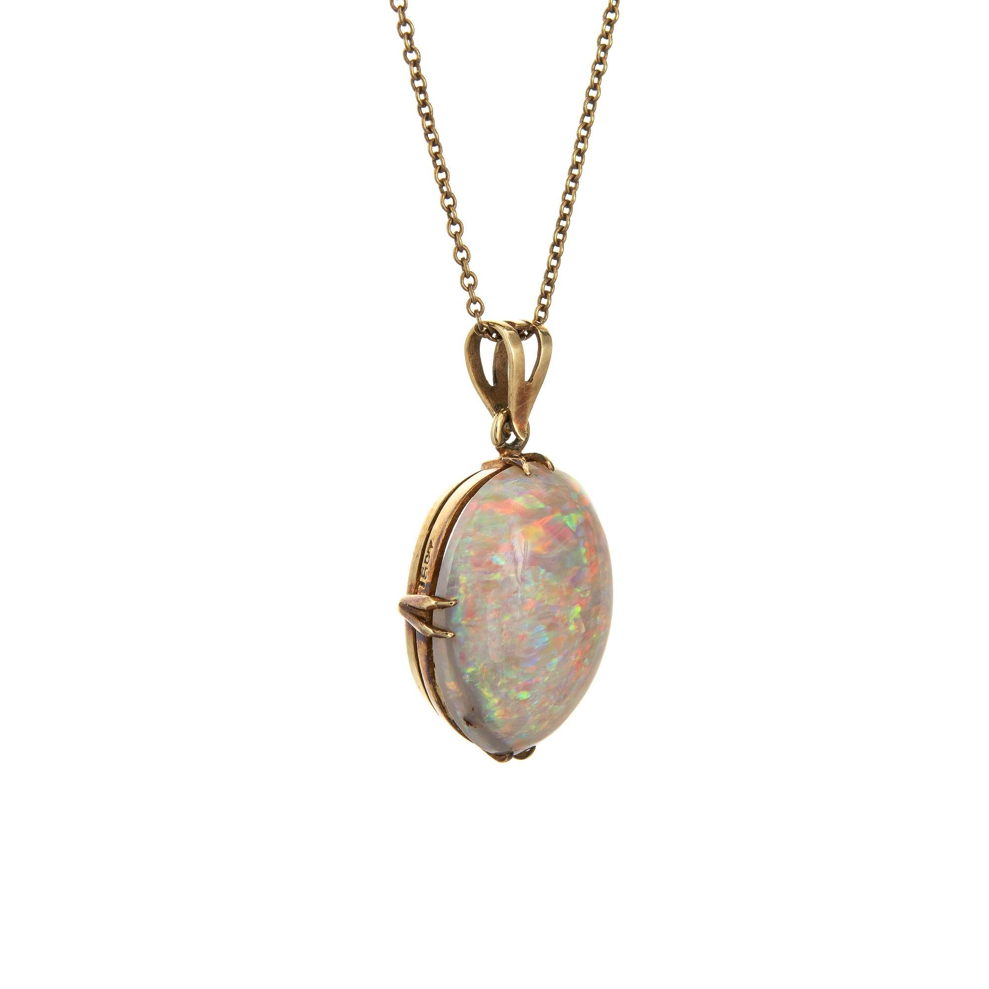 Stylish antique Victorian natural opal pendant & necklace crafted in 15 karat yellow gold (circa 1880s to 1900s). 

Solid natural opal measures 17mm x 13 (estimated at 8 carats). The opal is in very good condition and free of cracks or chips.

The