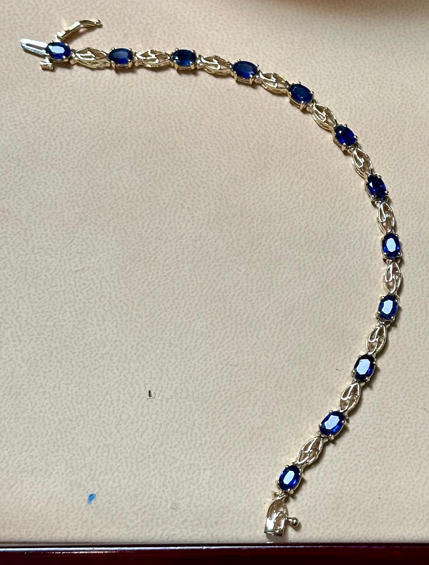  Natural Oval  Blue Sapphire  Tennis Bracelet 14 Karat White Gold, 7 Inch Long
This exceptionally affordable Tennis  bracelet has  12 Oval  stones of sapphire set in a 14 Karat white gold
Total weight of Sapphire is approximately 8 carat. 
The