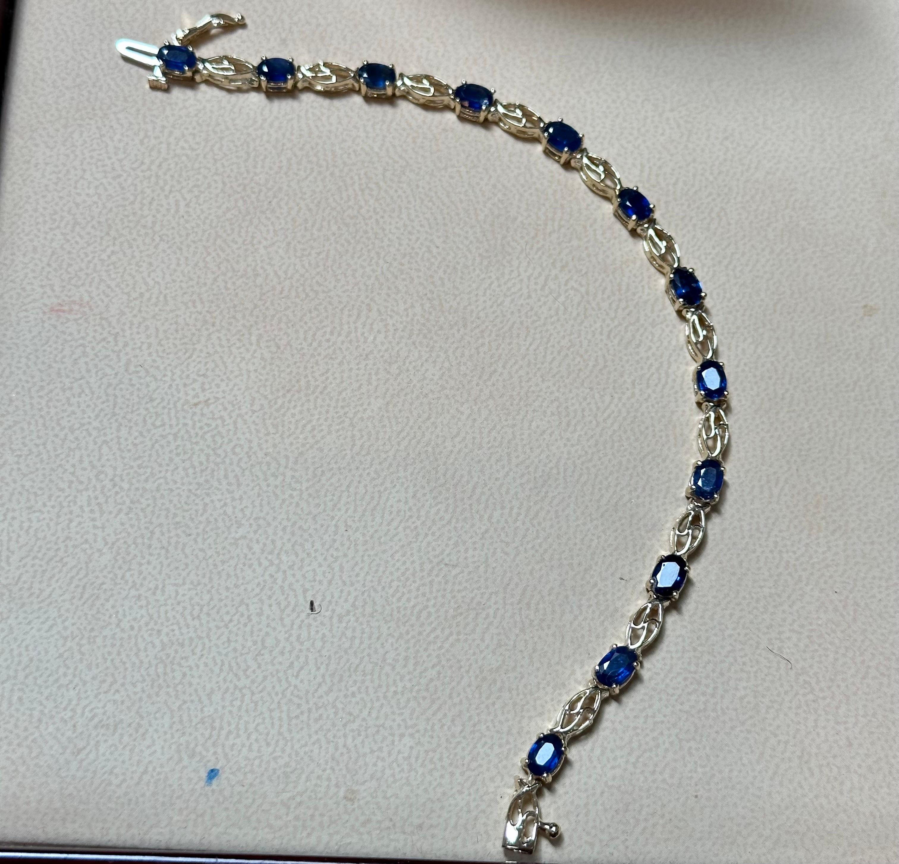 Oval Cut 8Ct Natural Oval Blue Sapphire Tennis Bracelet 14 Karat Yellow Gold, 7 Inch Long For Sale