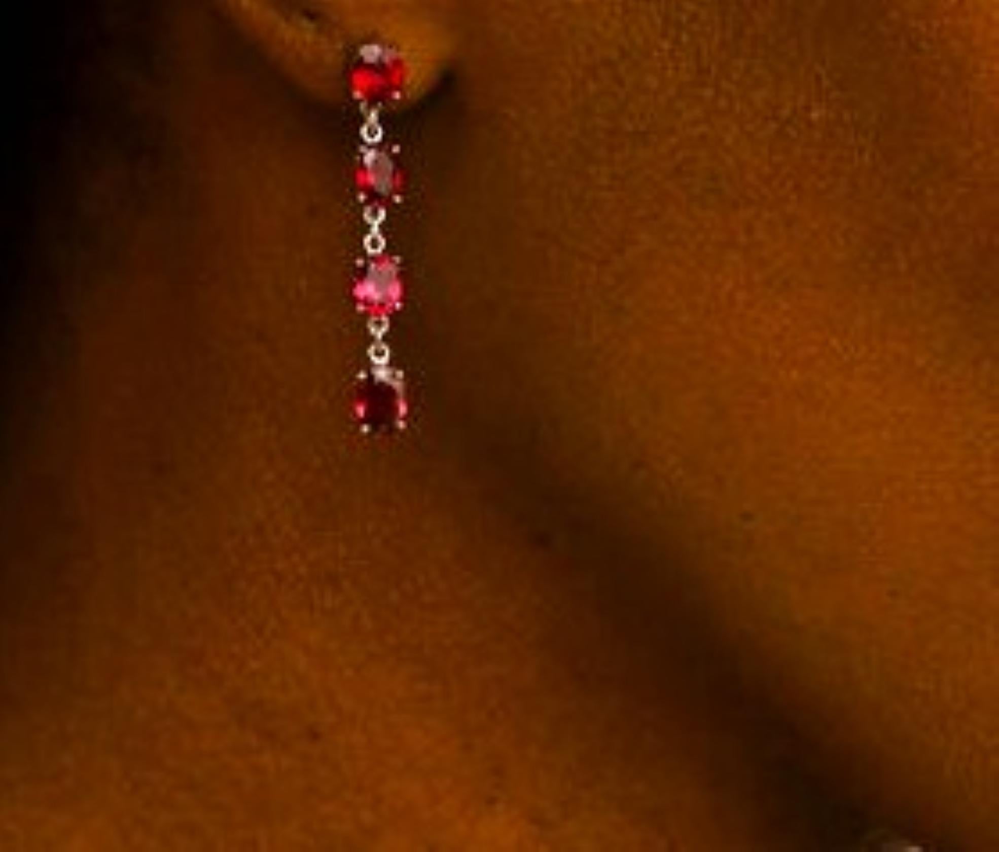 Natural Oval Garnet Pin Dangle Earrings, a pair of exquisite accessories that combine the allure of garnet gemstones with an elegant classic design. These earrings feature four stunning 1-carat each natural oval garnets, each delicately suspended,