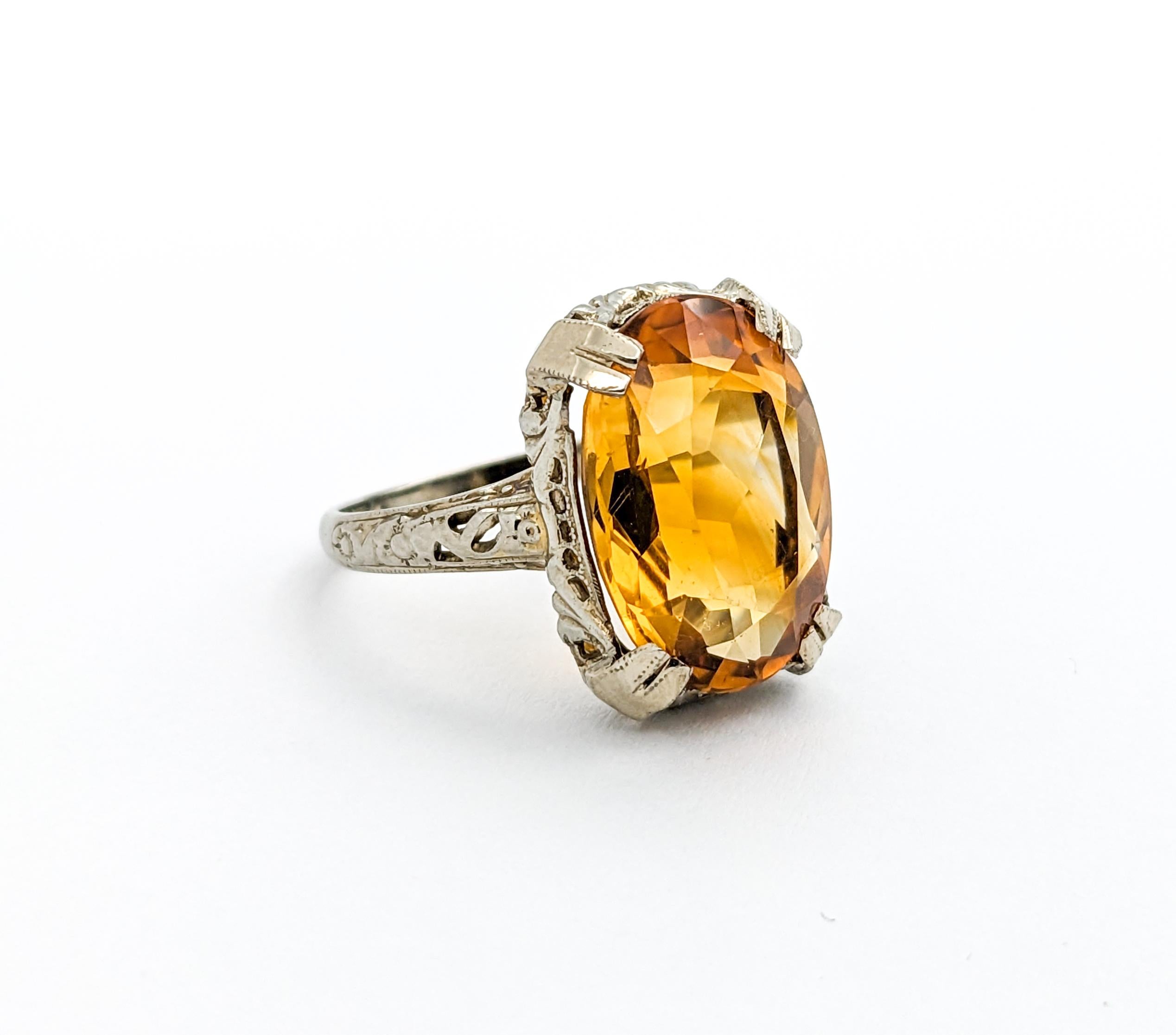 8ct Oval Citrine Ring In White Gold

Introducing a magnificent Citrine Ring with a beautiful Art Deco Filigree setting in 14K white gold. At the heart of this exquisite piece is an 8ct 15.5x11.3mm oval citrine, radiant with honey-like warmth. The