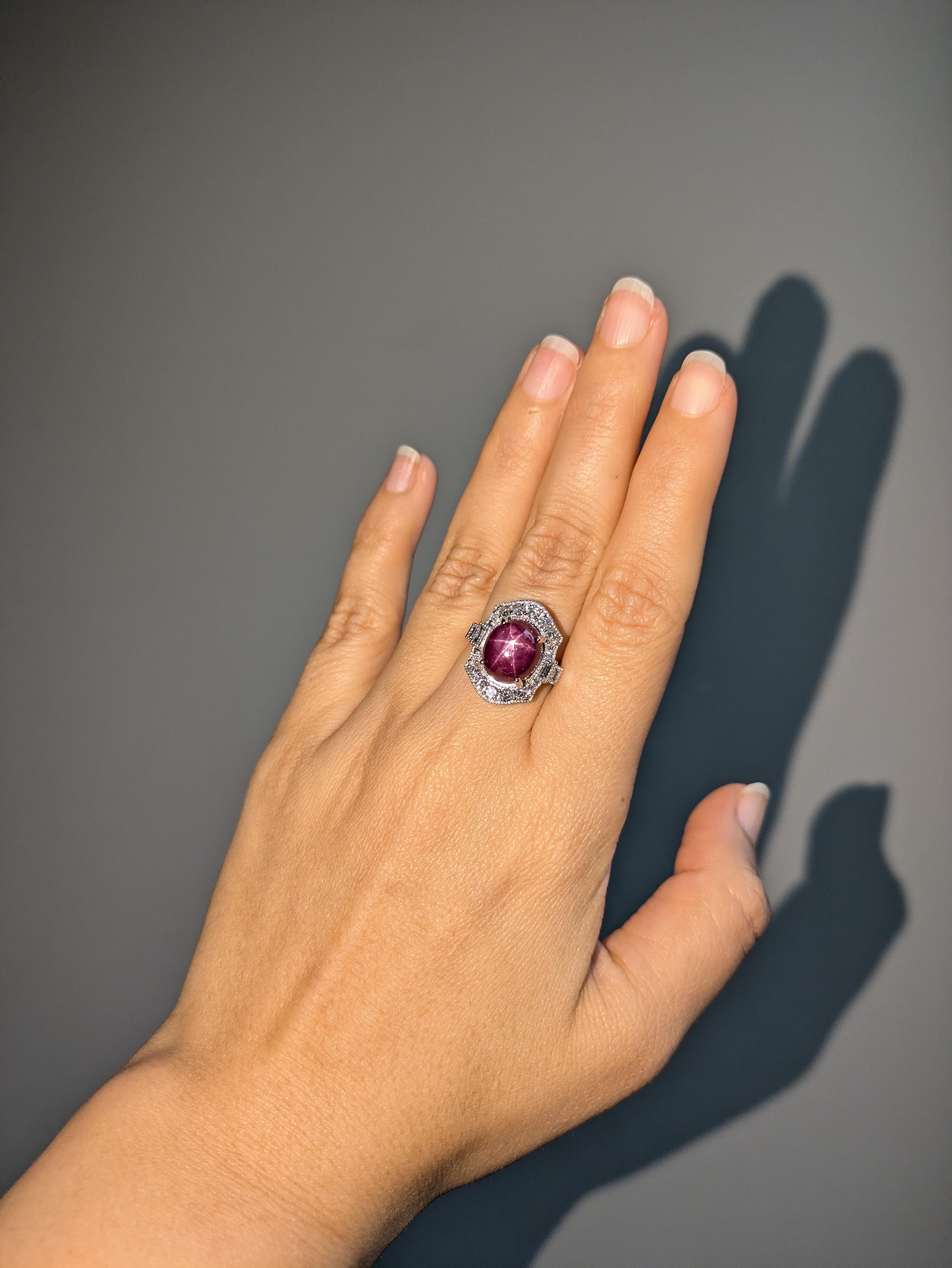 This gorgeous ring is sure to make a statement with a natural ruby center stone and unique natural earth mined diamond pattern in solid 14k white gold! This art deco style ring can be a lovely July birthstone gift for your loved ones!