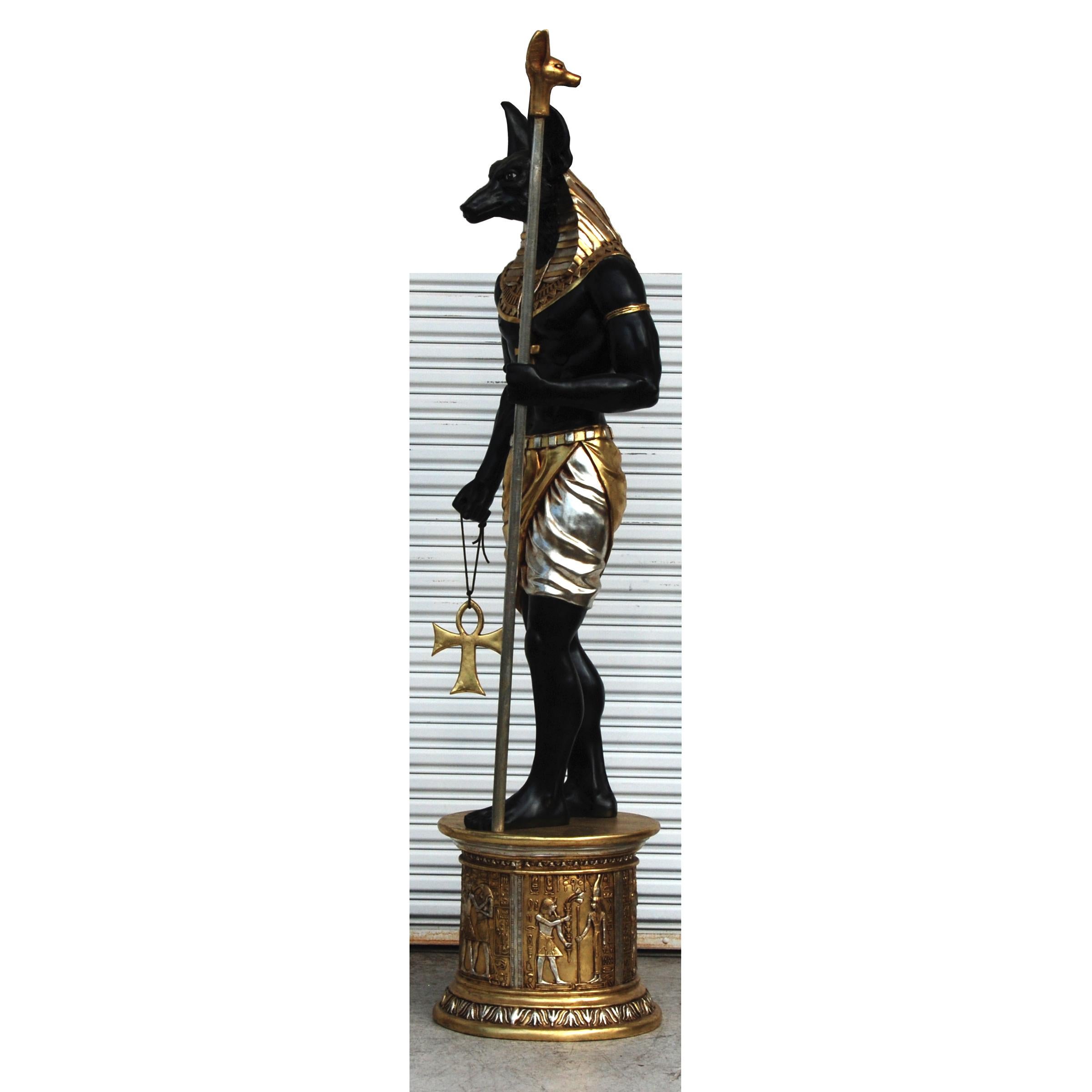 About The Egyptian God Anubis: He was recognized as a God of the dead and mummification, was believed by the Ancient Egyptians to have invented the process of embalming. Anubis is one of the oldest Egyptian Gods.

Statue features ornate gold