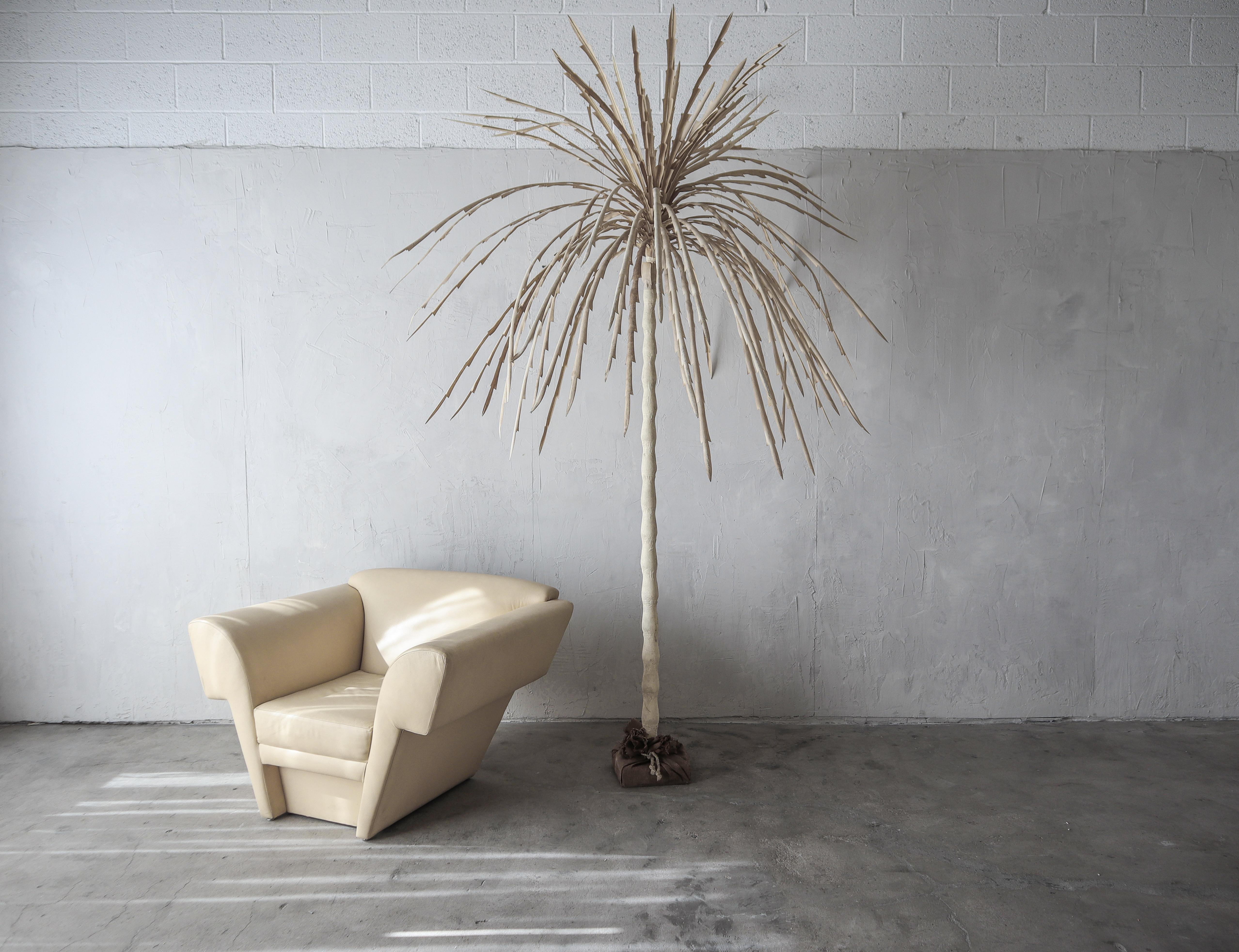 Incredible Post Modern canvas palm tree. Super cool, super sculptural. This tree is large, measuring over 8ft, perfect size to be used as a retail fixture or in a home with high ceilings. Created out of canvas over metal.

Tree has what I'd
