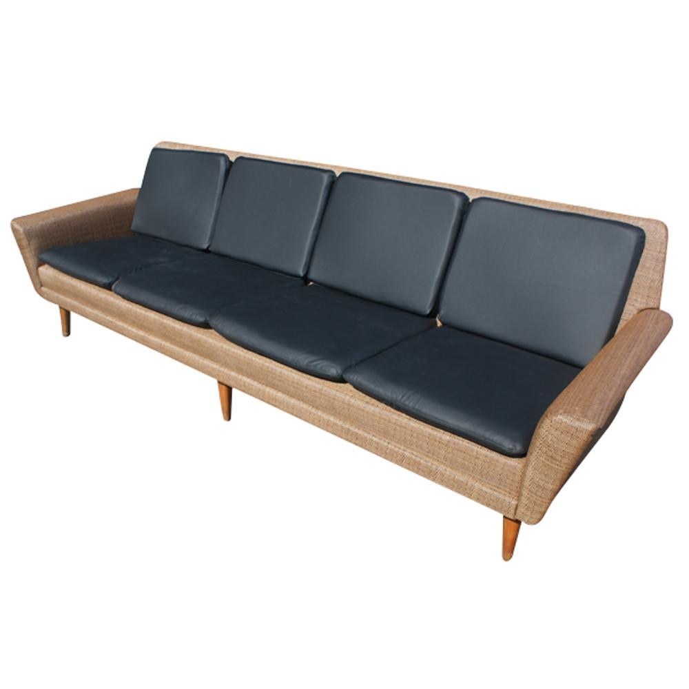 8ft four-seat dux leather sofa by Folke Ohlsson
Sweden,
1960s

Danish modern sofa upholstered in tan and black grass cloth
Black leather detachable cushions
Tapered wood legs

Measures: Width 96