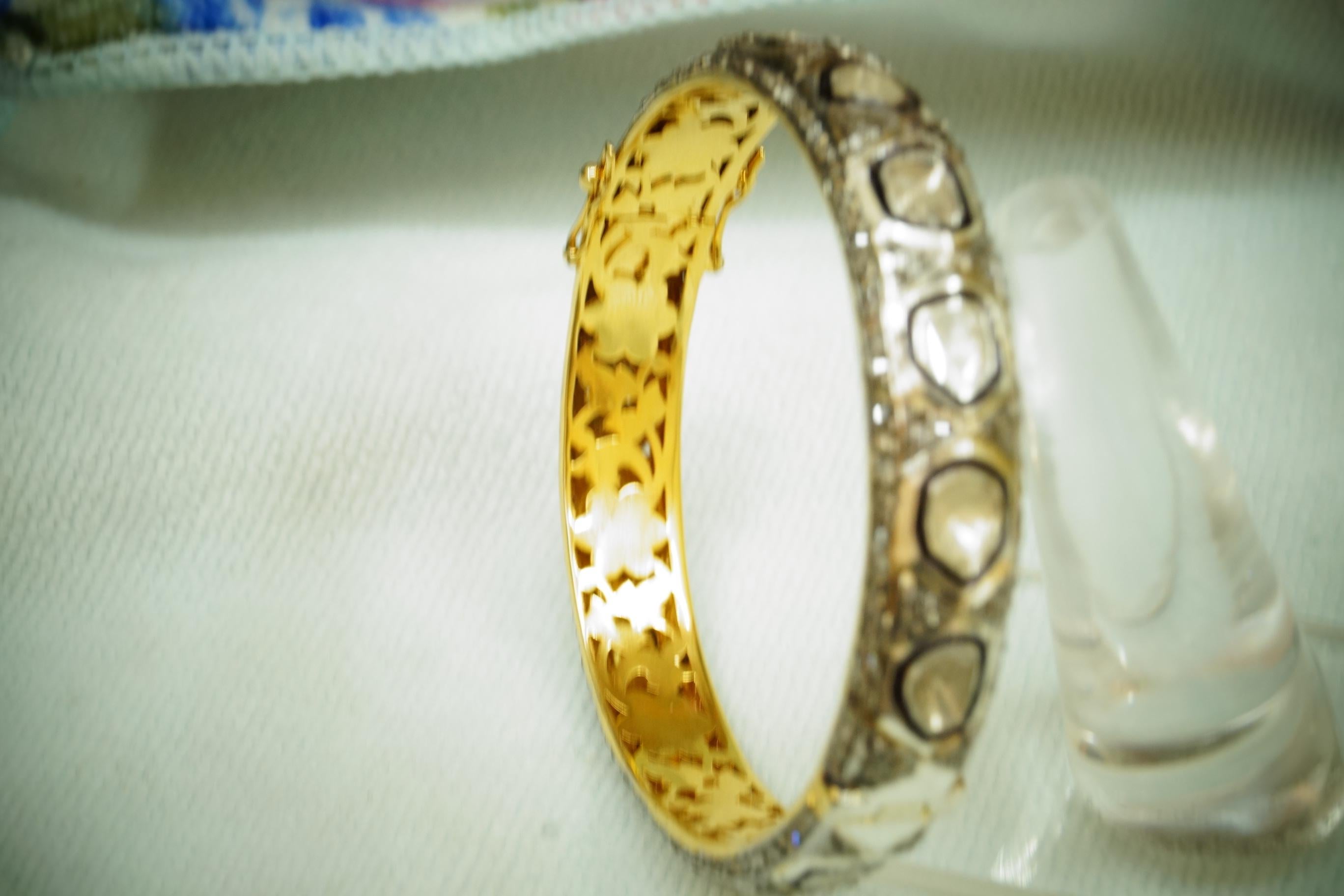 This stunning bangle bracelet is one of its kind.
It consists of:
Diamond- Natural diamonds
Diamond color- Tinted yellow
Metal- 18k gold and sterling Silver
Metal purity- 925 silver or sterling silver
Size- 8