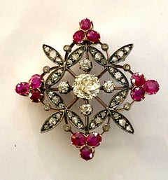 18 Karat & Silver Brooch Set with 1 Diamond 1.76 Ct+12 Ruby 3.76 Ct + 48 Diamond