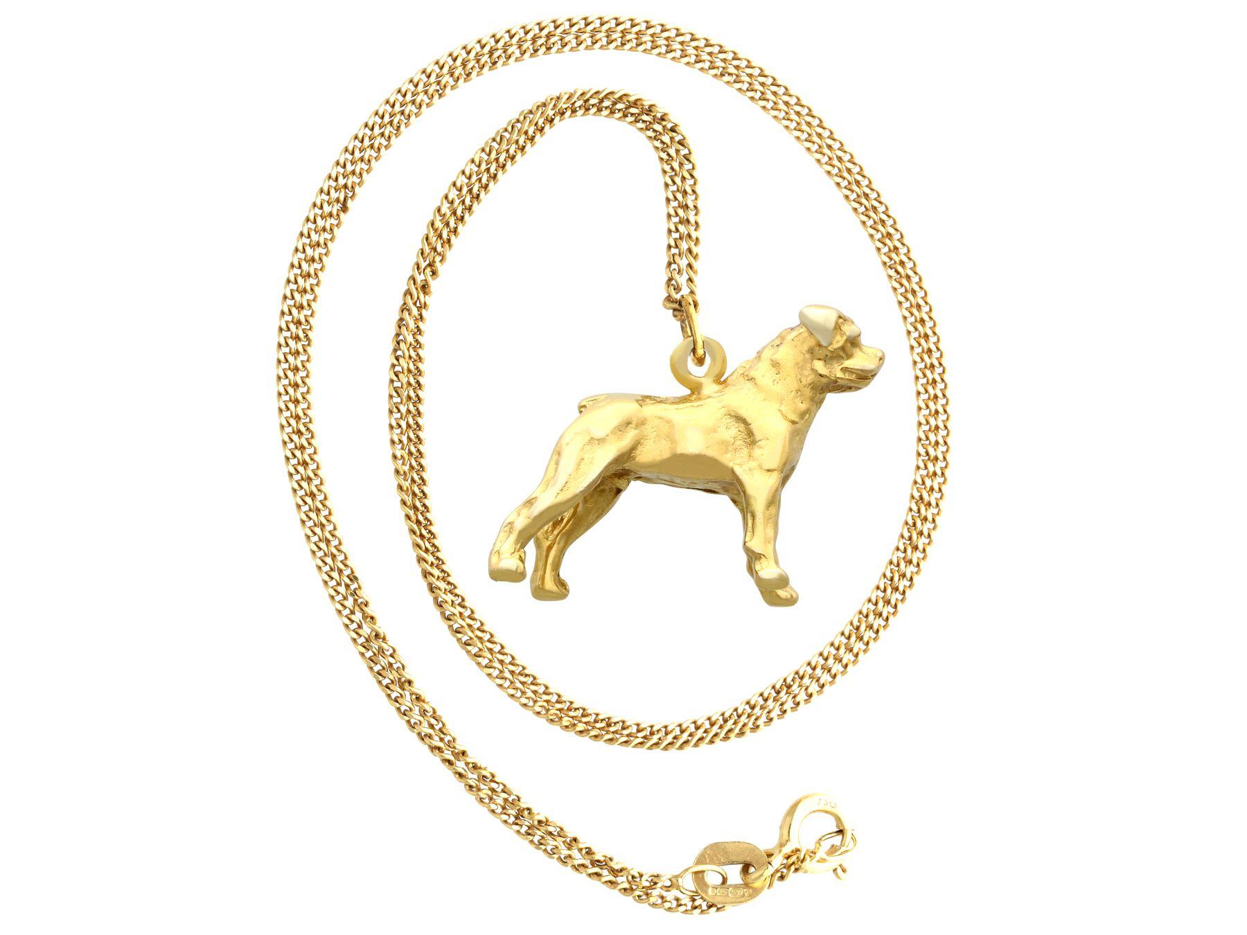 A fine and impressive vintage 8 karat yellow gold charm/pendant in the form of a Boxer dog; part of our diverse gemstone jewelry and estate jewelry collections

This fine and impressive vintage gold dog pendant has been crafted in 8k yellow