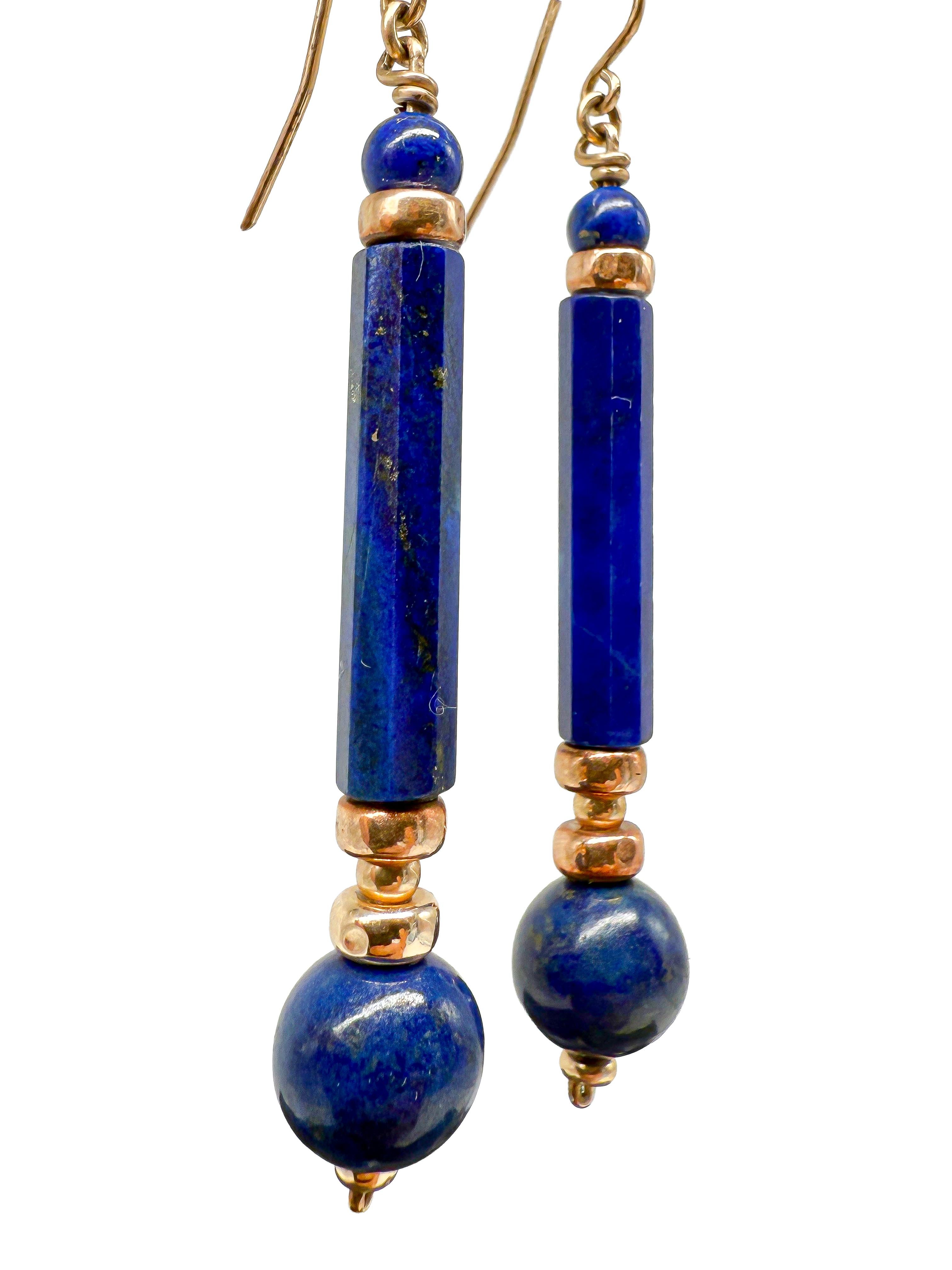 These elegant stud earrings combine classic elegance with a stylish, timeless appeal. Crafted from high-quality 8 karat yellow gold, the earrings display a luxurious shine, further enhanced by the artistic combination with deep blue gemstones. With