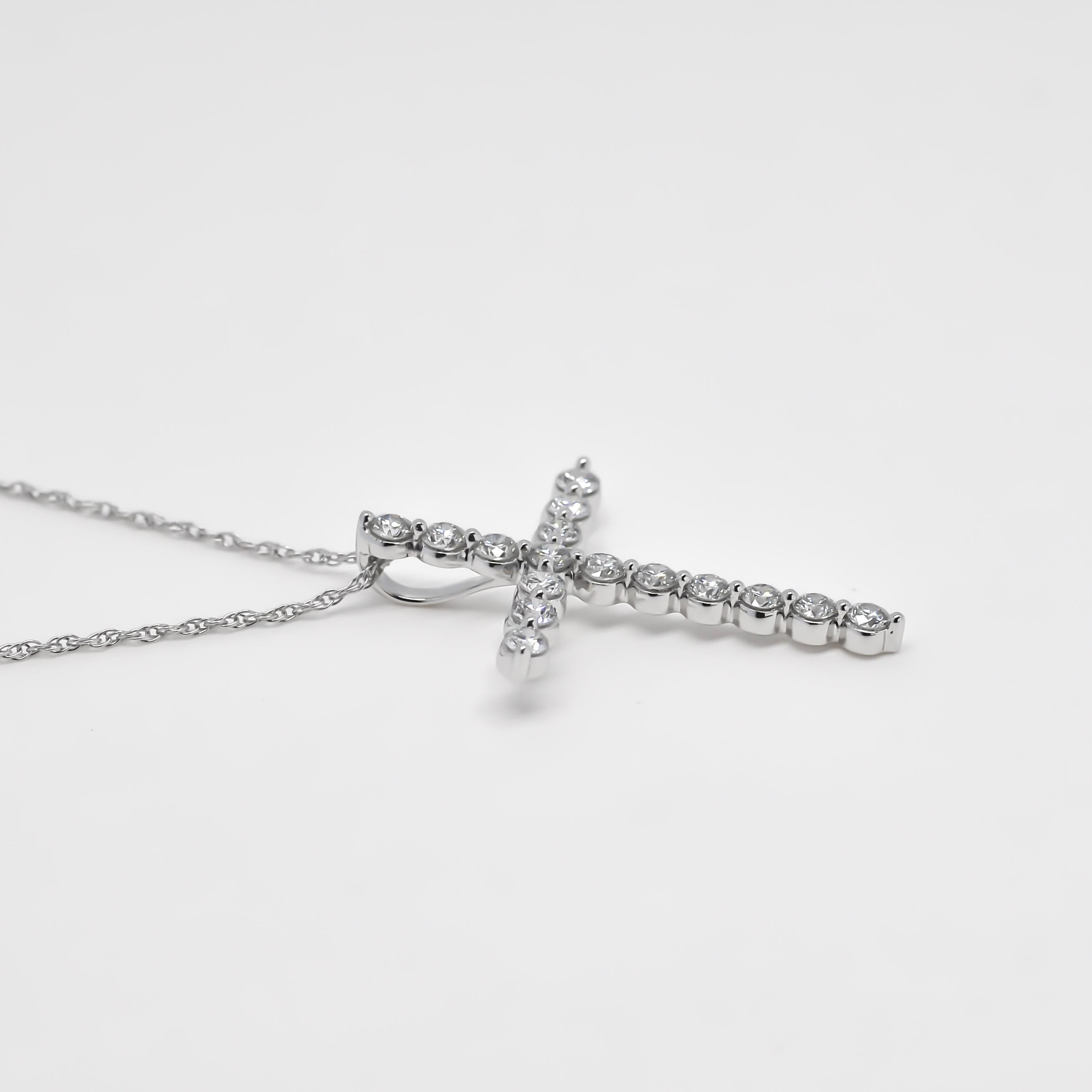 Brilliant Cut 8 Karat White Gold Natural Diamond Classic Cross Crucifix Shared Prong Pendant For Sale
