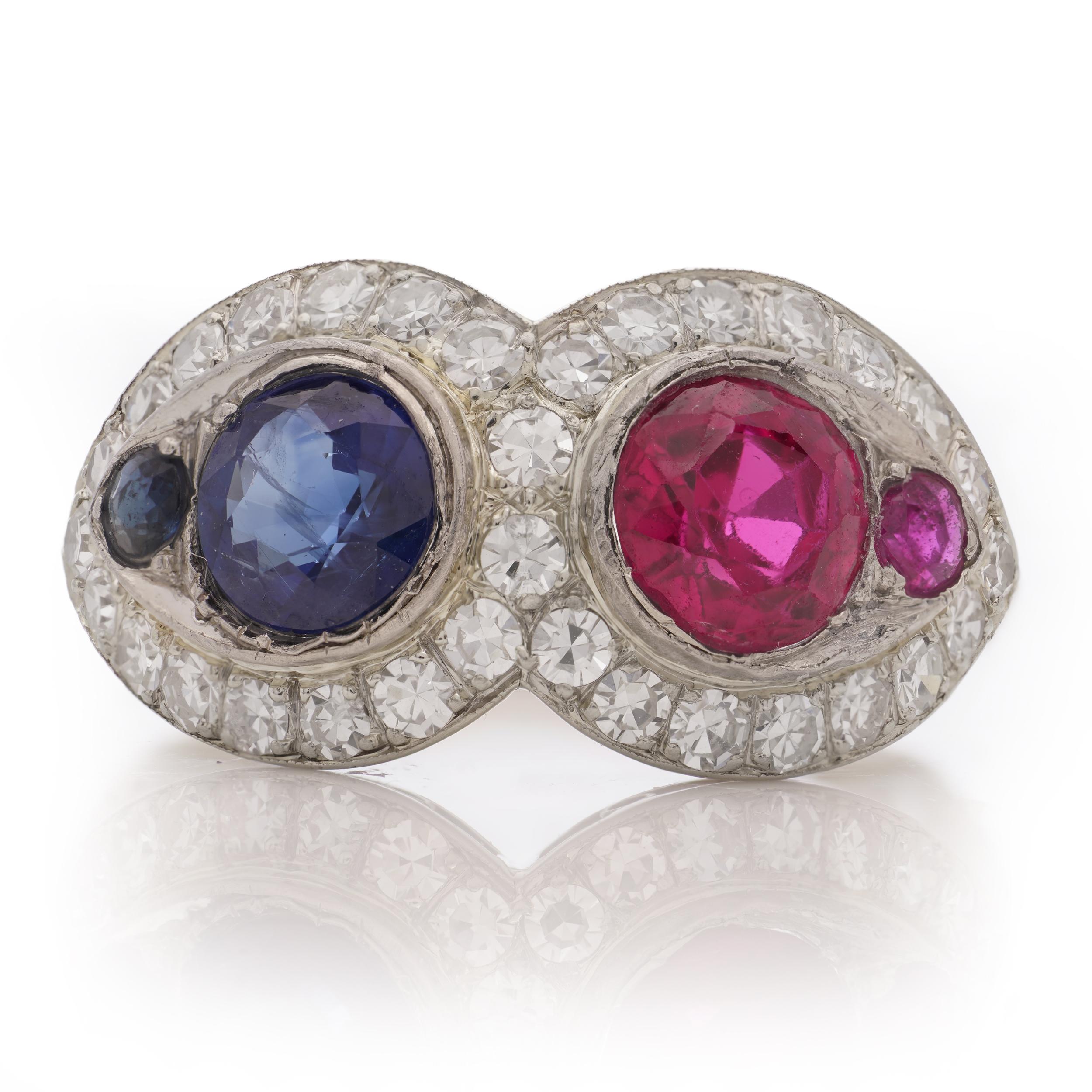 Round Cut 18kt. white gold ruby and sapphire ring, surrounded by round brilliant diamonds For Sale
