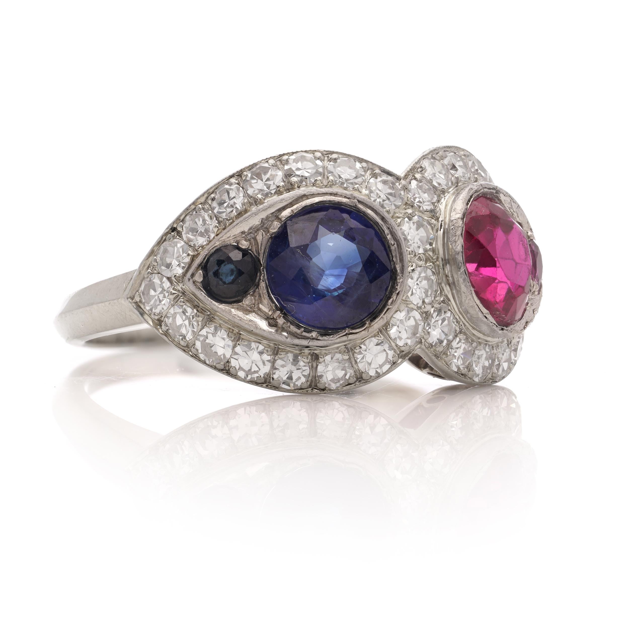 Women's 18kt. white gold ruby and sapphire ring, surrounded by round brilliant diamonds For Sale