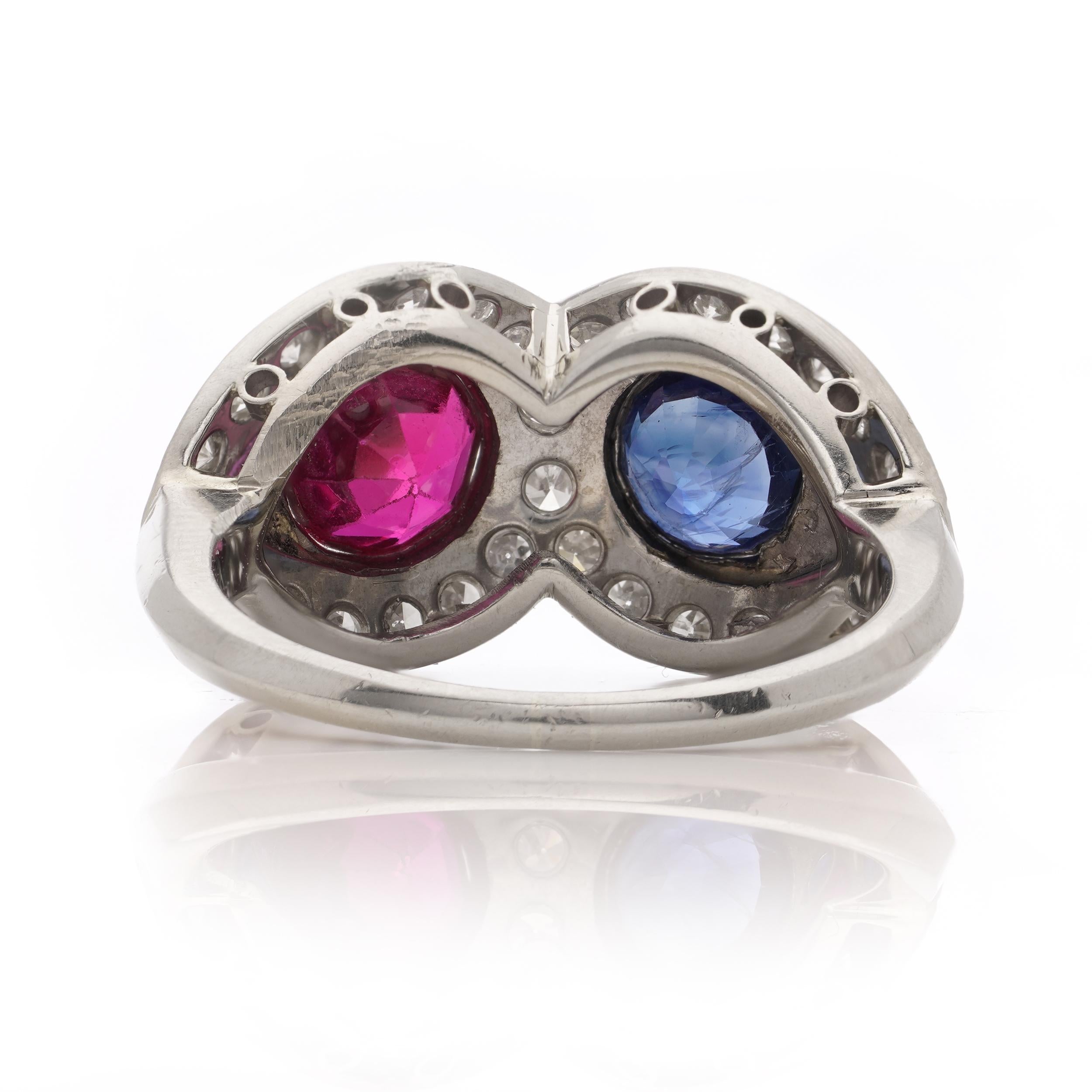 18kt. white gold ruby and sapphire ring, surrounded by round brilliant diamonds For Sale 2