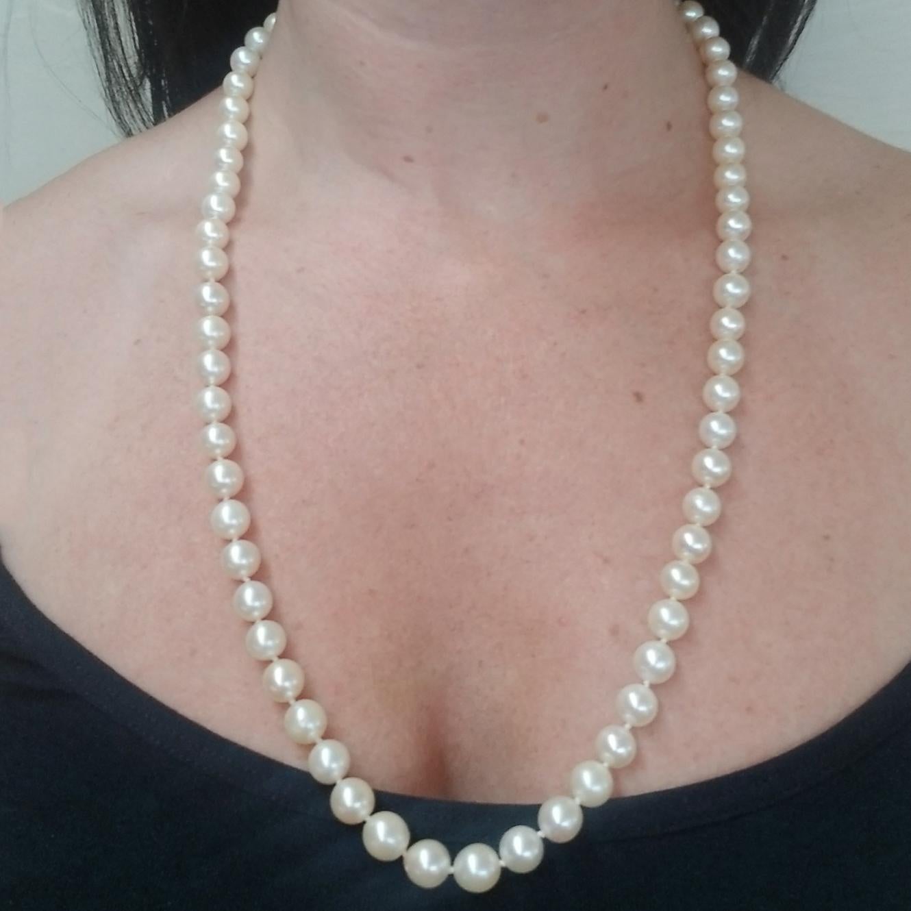 14 Karat Yellow Gold & 8mm-8.5mm Cultured Pearl Necklace Featuring 68 Off-White Round Pearls. 24 Inches Long with Ball Clasp.