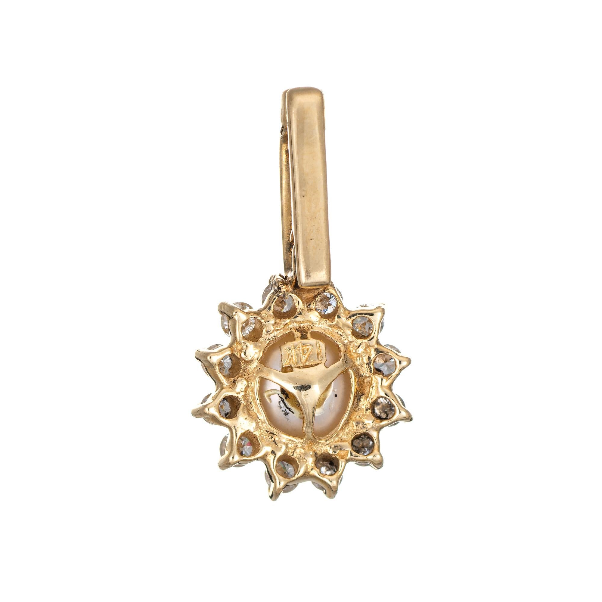 Finely detailed vintage cultured pearl & diamond pendant crafted in 14k yellow gold.

8mm cultured pearl is accented with 12 estimated 0.02 carat diamonds. The diamonds total an estimated 0.24 carats (estimated at H-I color and SI1-2 clarity).
 
The