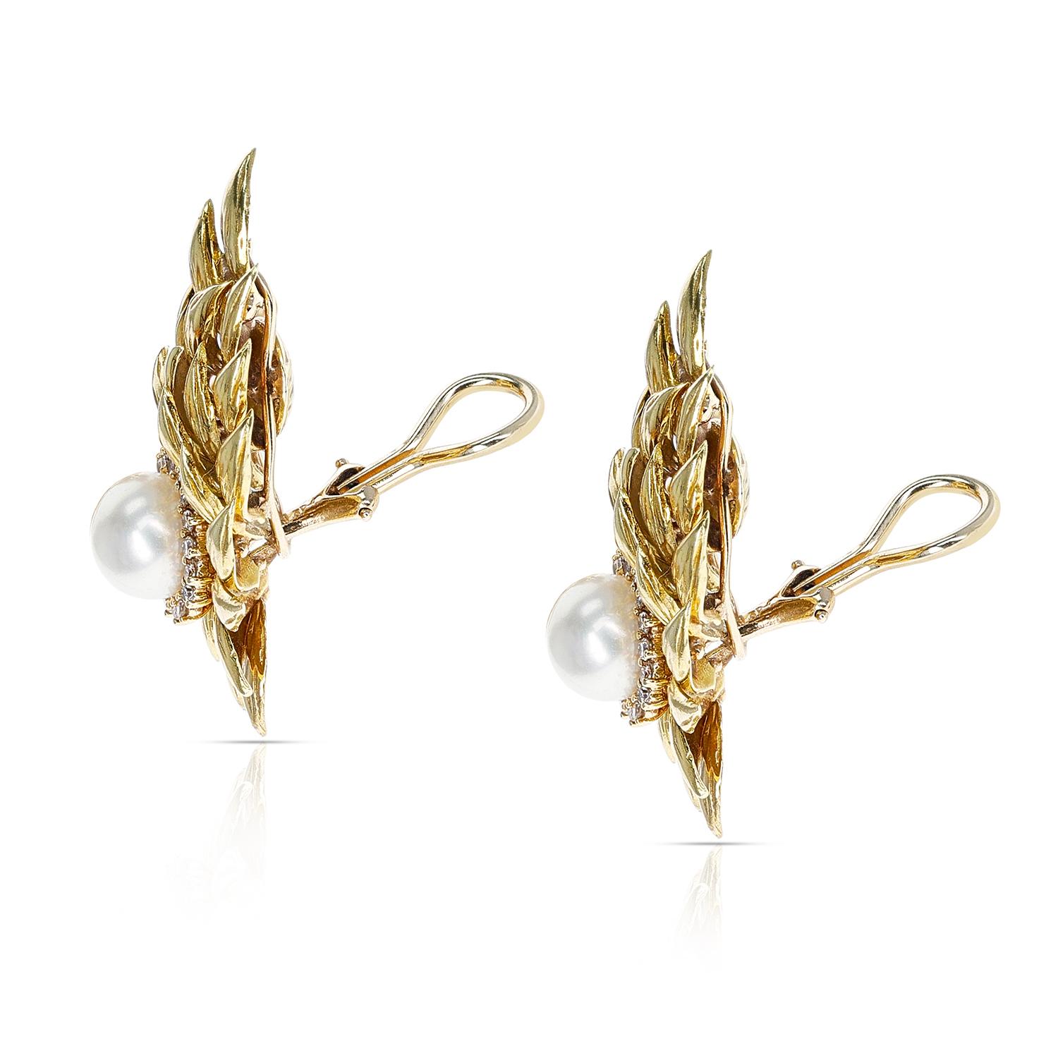 A 8MM Cultured Pearl Earrings with a Diamond Halo in 18K Gold Leaf-Style Design. The diamonds weigh appx. 0.40 carats. The earrings weigh a total of 10.50 grams. The dimensions are 1.5