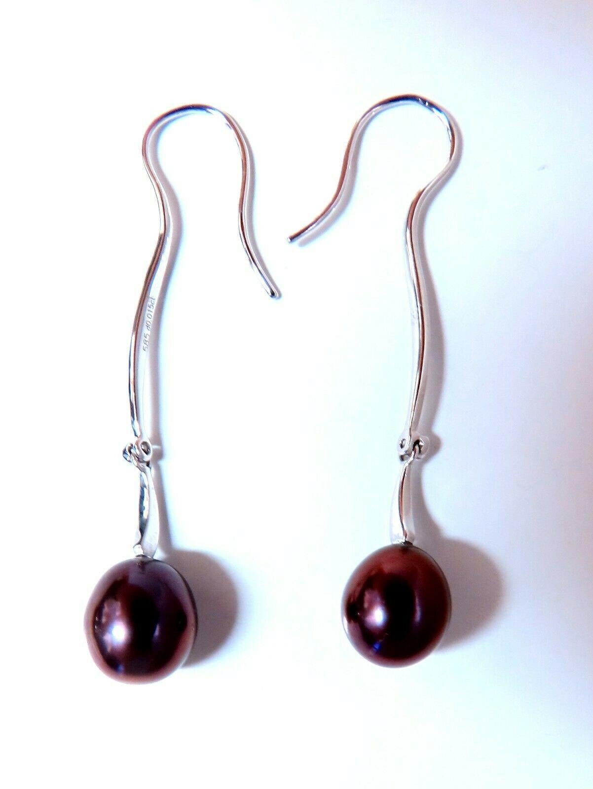 Boucles d'oreilles pendantes en perles d'eau douce.

perles de 8 mm de large

Excellent lustre AAA 

or blanc 14 carats 3,4 g.

Les boucles d'oreilles mesurent 1,75 pouce de long

Comfortable Wire