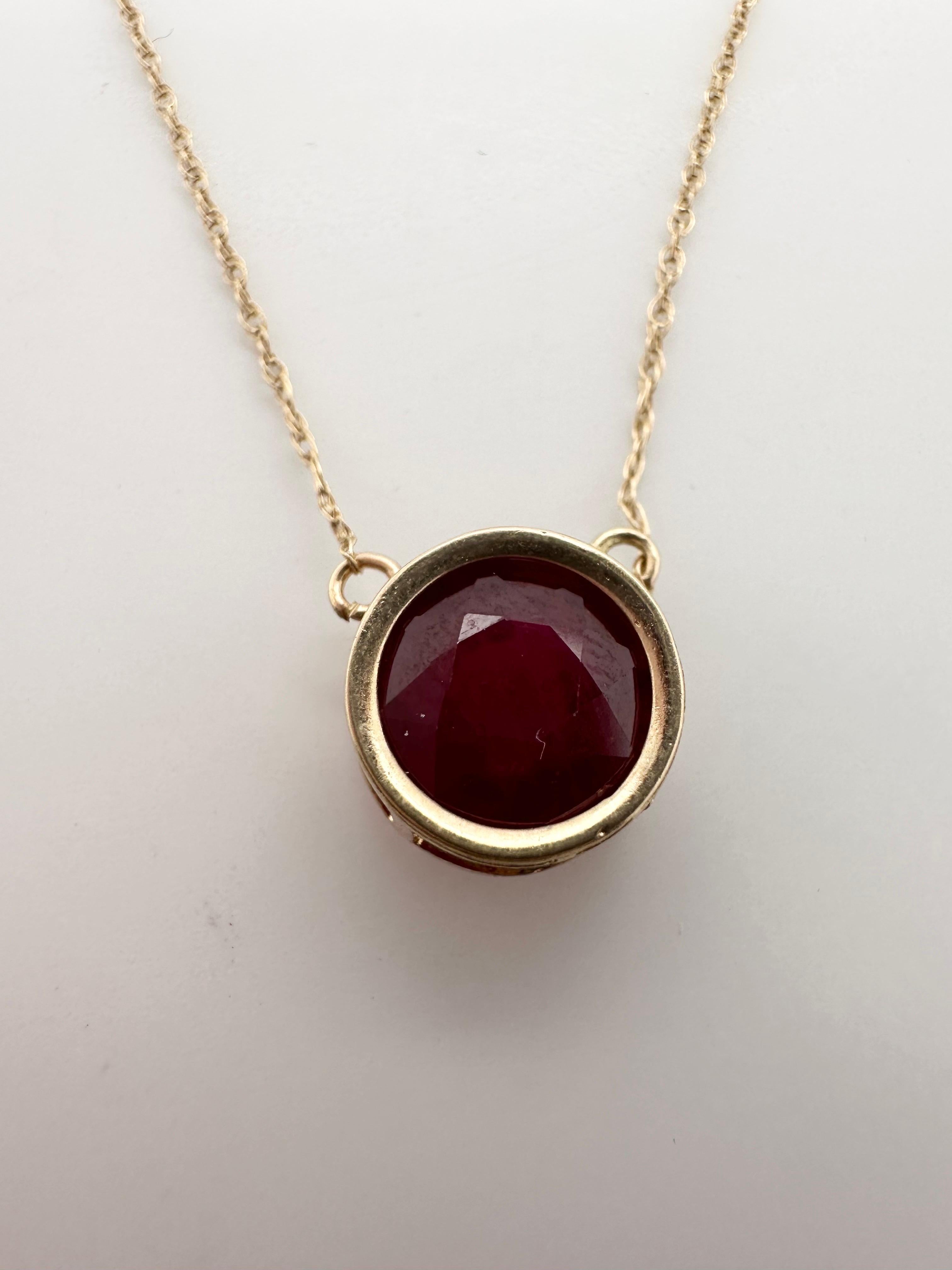 Natural 8mm ruby made in bezel setting in 10KT yellow gold, chain is 17