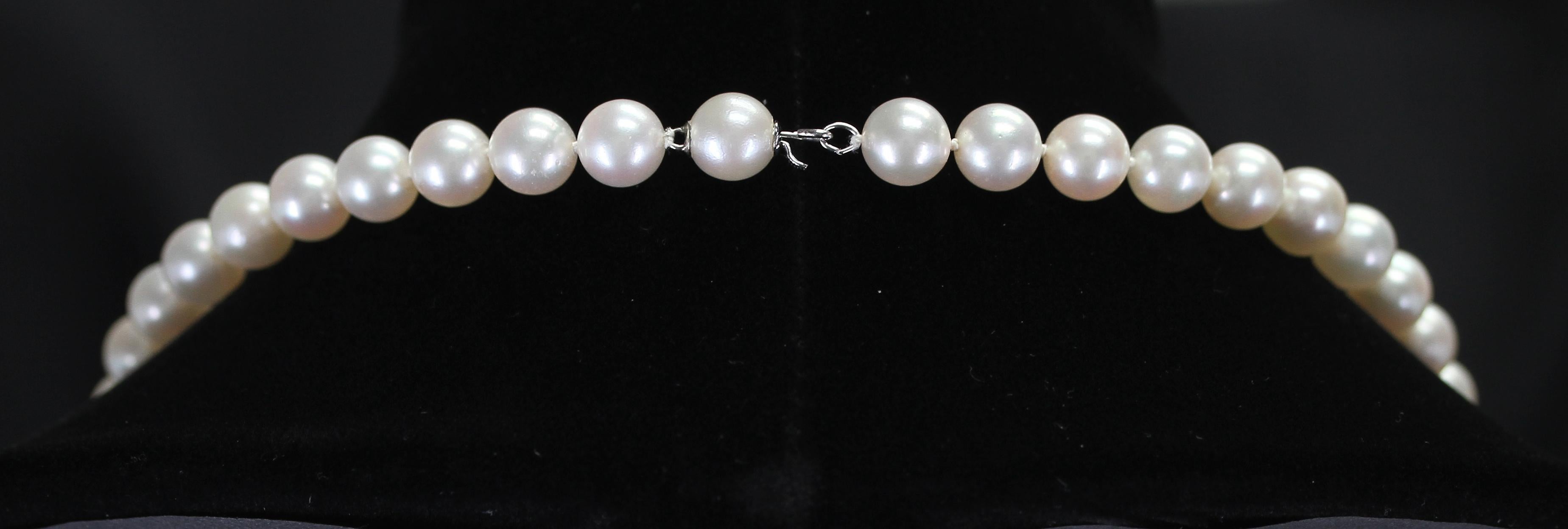 A classic strand of smooth cultured pearls necklace with a pearl clasp that blends in. Length: 22 Inches, Range: 8MM, Weight: 257 cts