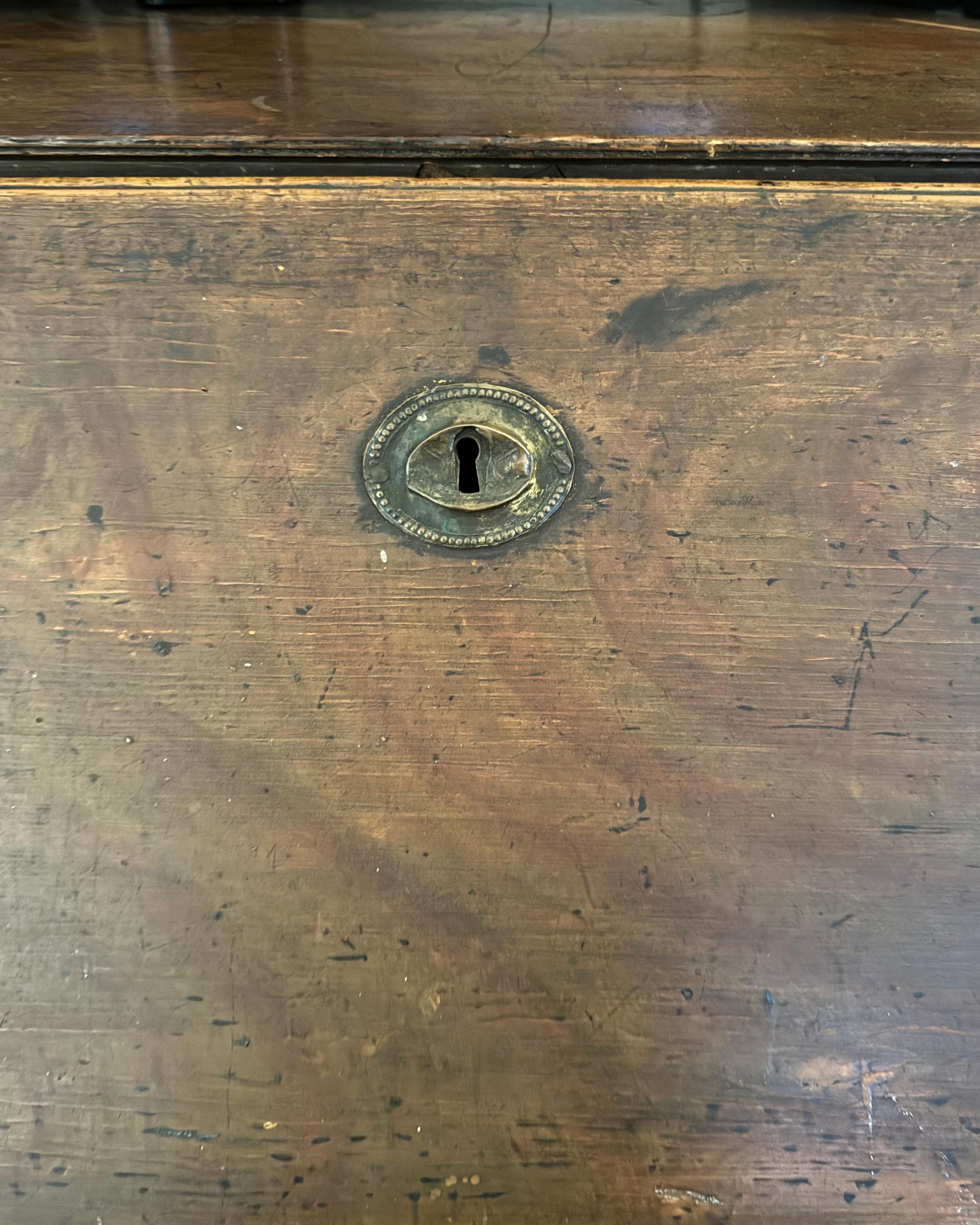 Rare 18th-century English Georgian-style secretary or butler chest, never restored with original patina, three drawers with secretary in top drop drawer, original hardware, dove tail joints connecting top to sides are slightly warped and pulled