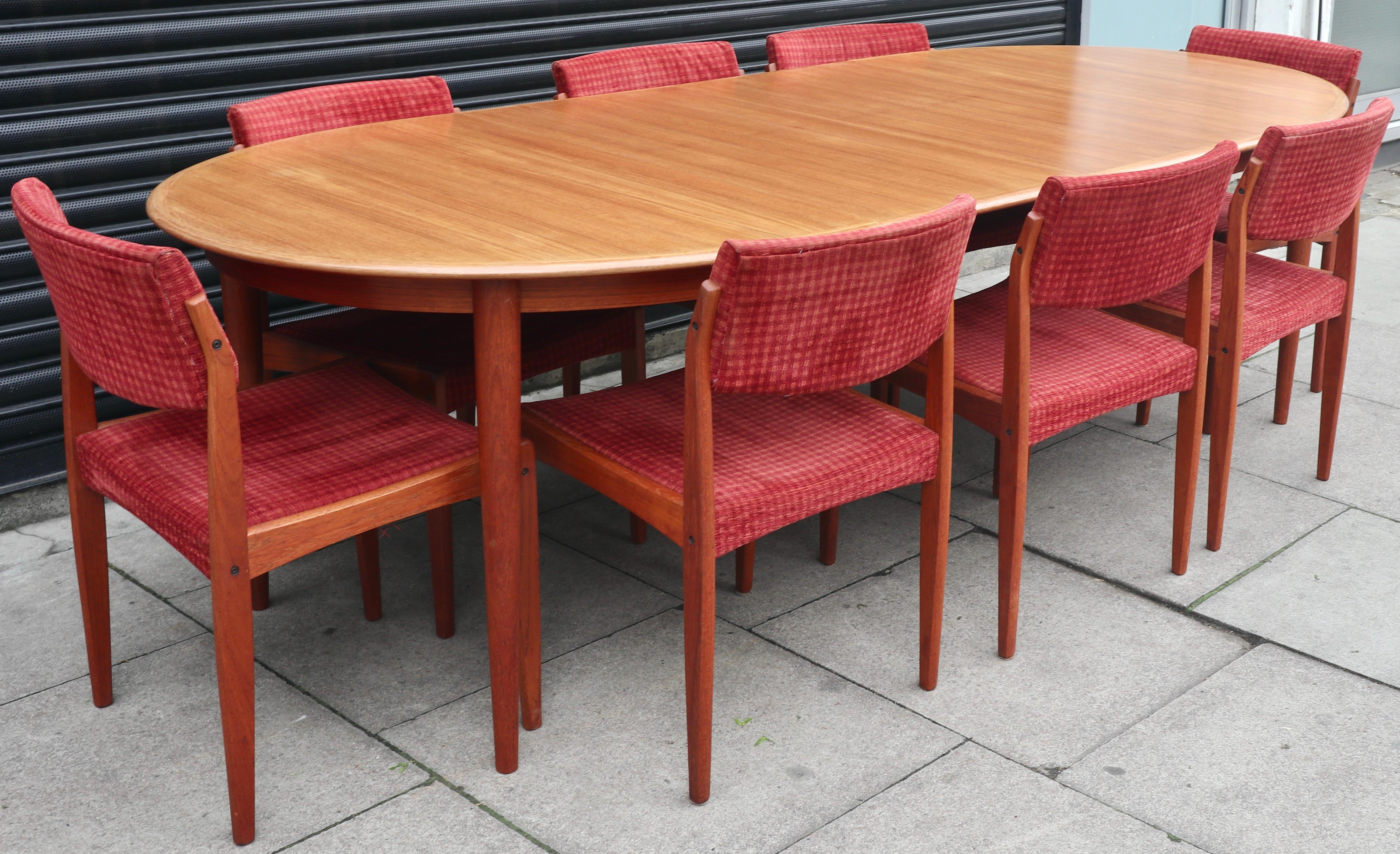 A very stylish set of eight teak framed 1960s Danish dining chairs with original textile.  These chairs were designed  by HW. Klein for Bramin, and are in good vintage condition, the woodwork, having been waxed and the textile cleaned.  All the