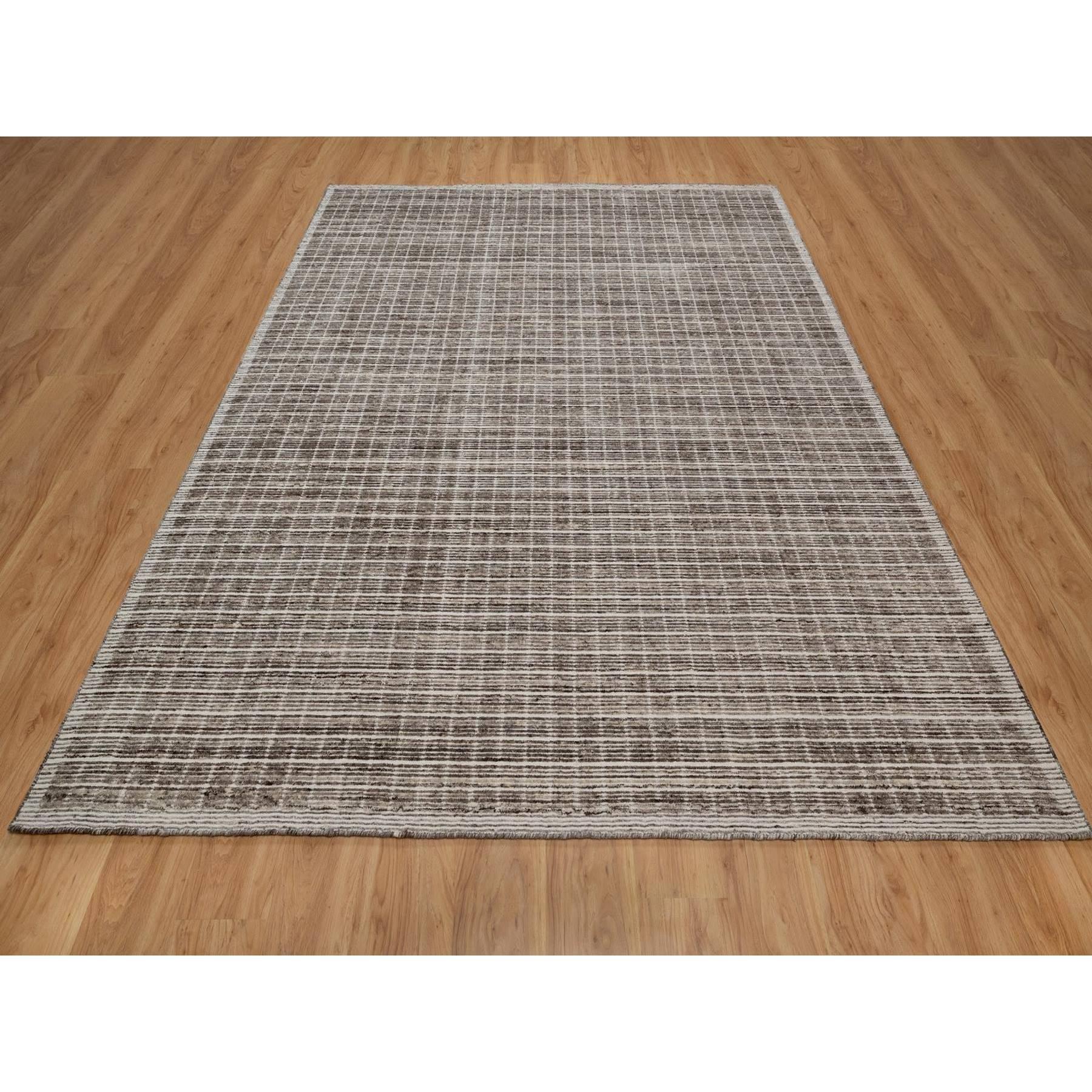Coffee Brown, Modern Plain Decor Box Design, Soft to Touch, Loomed Knotted, Pure Wool, Oriental Rug
Primary materials: Wool
Latex: No Pile 
height: 0.25 Inches
Style: Contemporary
Primary color: Brown
Secondary colors: Ivory
Pattern: Oriental