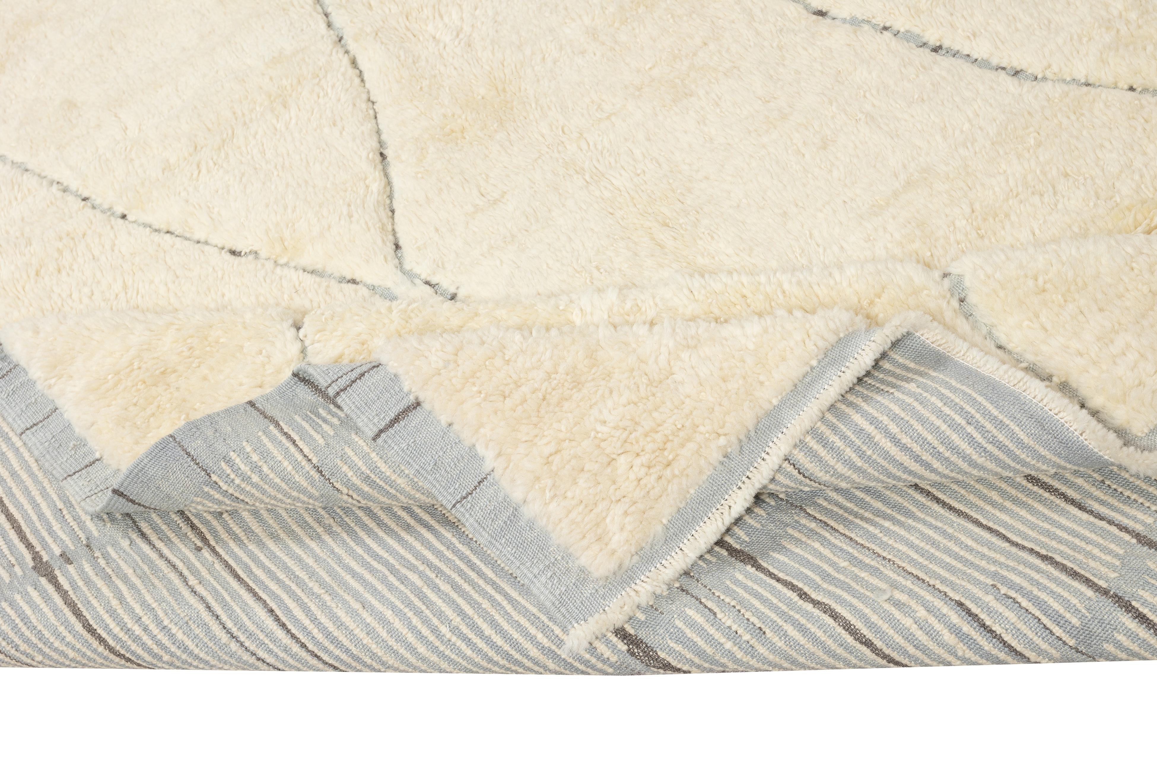 Elevate your living space with the exquisite charm of this new modern hand-knotted Moroccan berber beni ourain rug, crafted with precision and care from 100% wool. Combining the allure of Moroccan design with contemporary sensibilities, this rug is