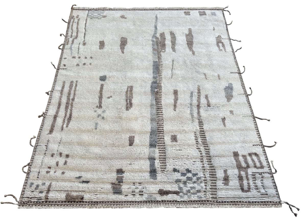 Elevate your living space with the exquisite charm of this new modern hand-knotted Moroccan berber beni ourain rug, crafted with precision and care from 100% wool. Combining the allure of Moroccan design with contemporary sensibilities, this rug is