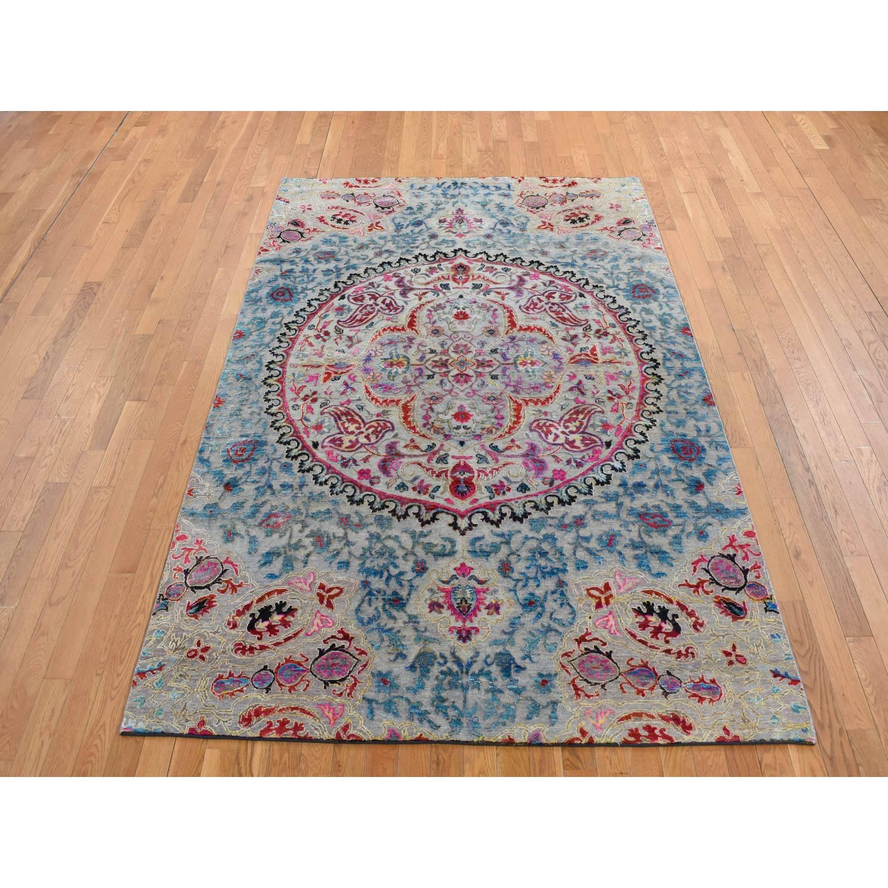 Thunder Gray, Sari Silk and Textured Wool, Colorful Maharaja Design, Hand Knotted, Oriental Rug
Primary materials: Wool & Silk
Latex: No Pile 
height: 0.25 Inches
Style: Transitional
Primary color: Grey
Secondary colors: Red, Blue, Pink, Yellow,