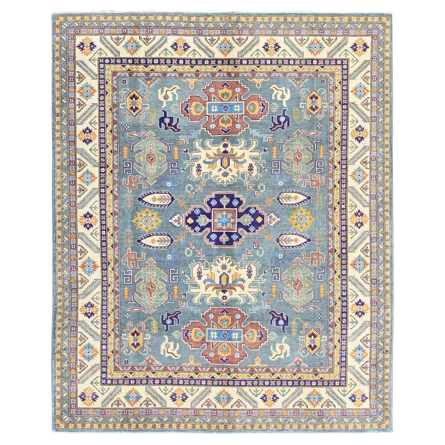 8
x10
Kazak grigio nebbioso con design tribale annodato a mano interamente in lana