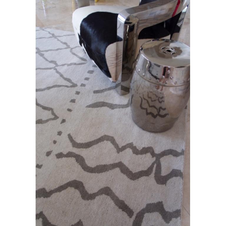 Deeply textured and organic, the simplicity of Moroccan weaving technique inspired this fine rug. Cozy and timeless this rug is both beautiful and contemporary, making it very easy to work with in contemporary as well as traditional spaces. Finely
