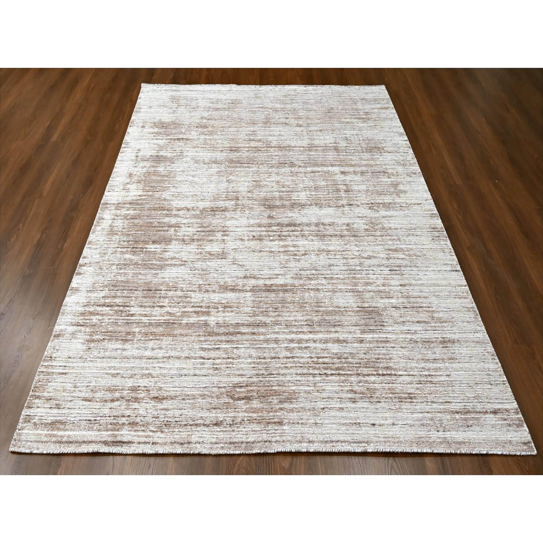 Shades of Brown, Hand Loomed, Wool and Plant Based Silk, Textured Pile, Borderless, Modern Design, Oriental Rug
Primary materials: Wool & Silk
Latex: No Pile 
height: 0.25 Inches
Style: Contemporary
Primary color: Brown
Secondary colors: Beige,