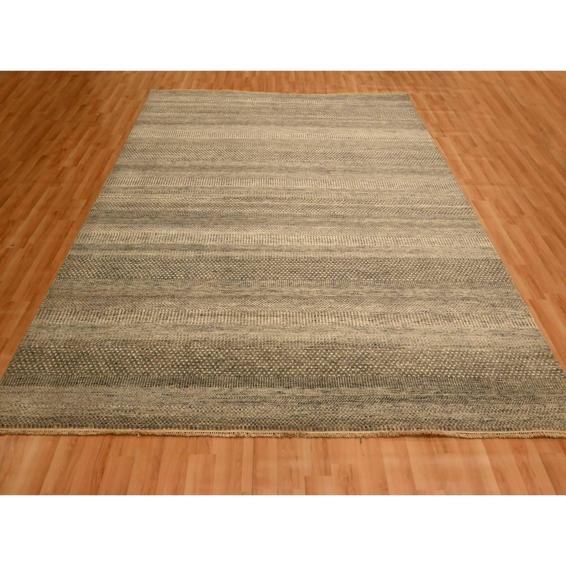 Stone Gray, Modern Grass Design, Undyed Natural Wool, Tone on Tone, Hand Knotted, Oriental Rug
Primary materials: Wool
Latex: No Pile 
height: 0.25 Inches
Style: Contemporary
Primary color: Grey
Secondary colors: Beige, Brown
Pattern: Oriental