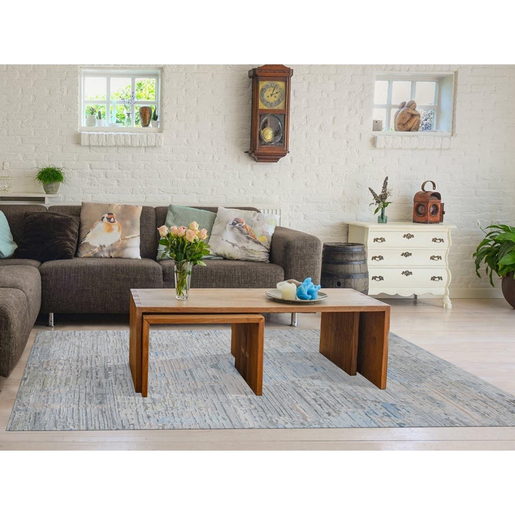 Ivory, Pure Silk, Hand Knotted, Modern Design, Longer Soft Pile, Pastel Colors, Oriental Rug
Primary materials: Wool & Pure Silk
Latex: No Pile 
height: 0.25 Inches
Style: Transitional
Primary color: Ivory
Secondary colors: Gray, Beige,