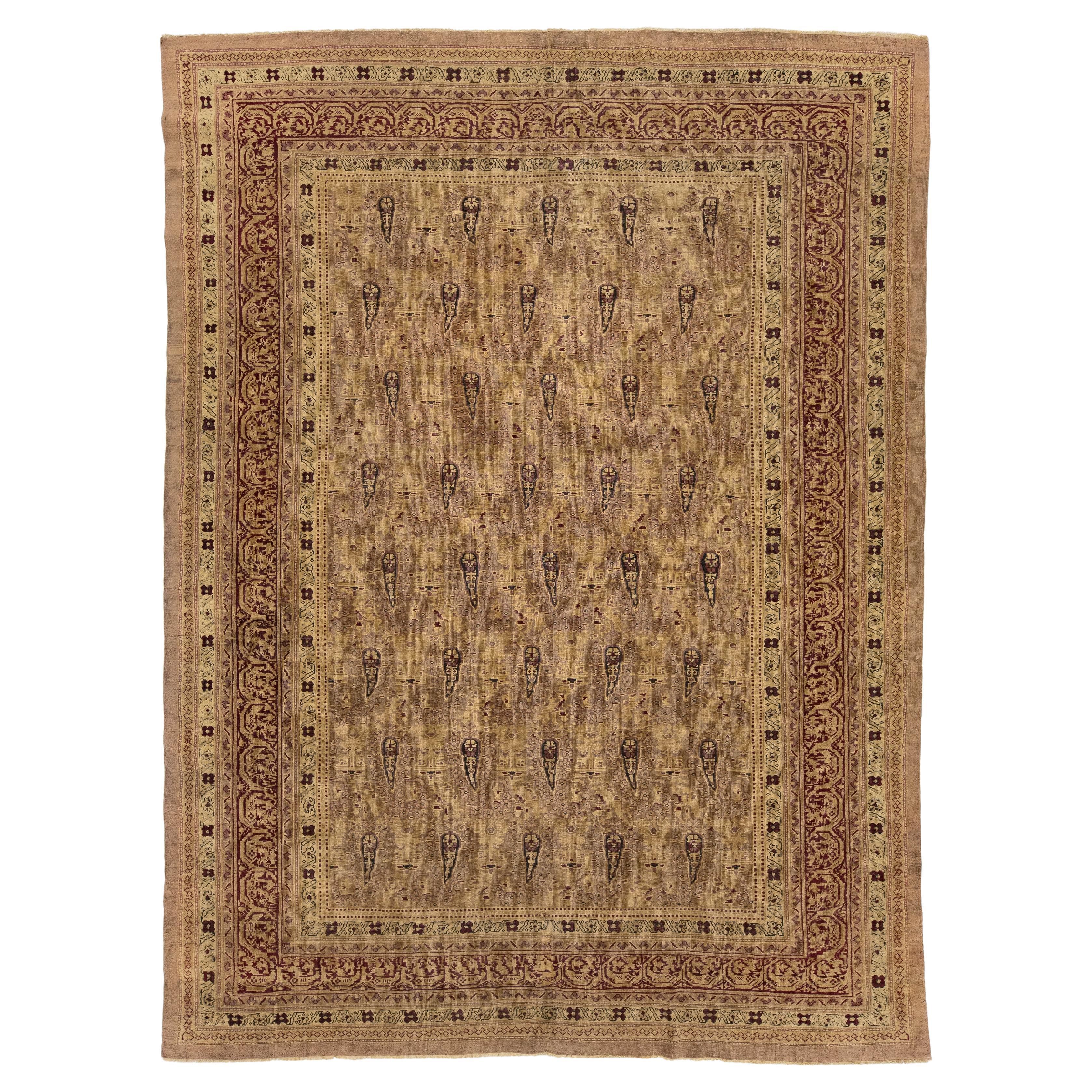 8x11 Antique Amritsar Wool Rug with Repeating Boteh Motif In Earth-Toned Palette For Sale