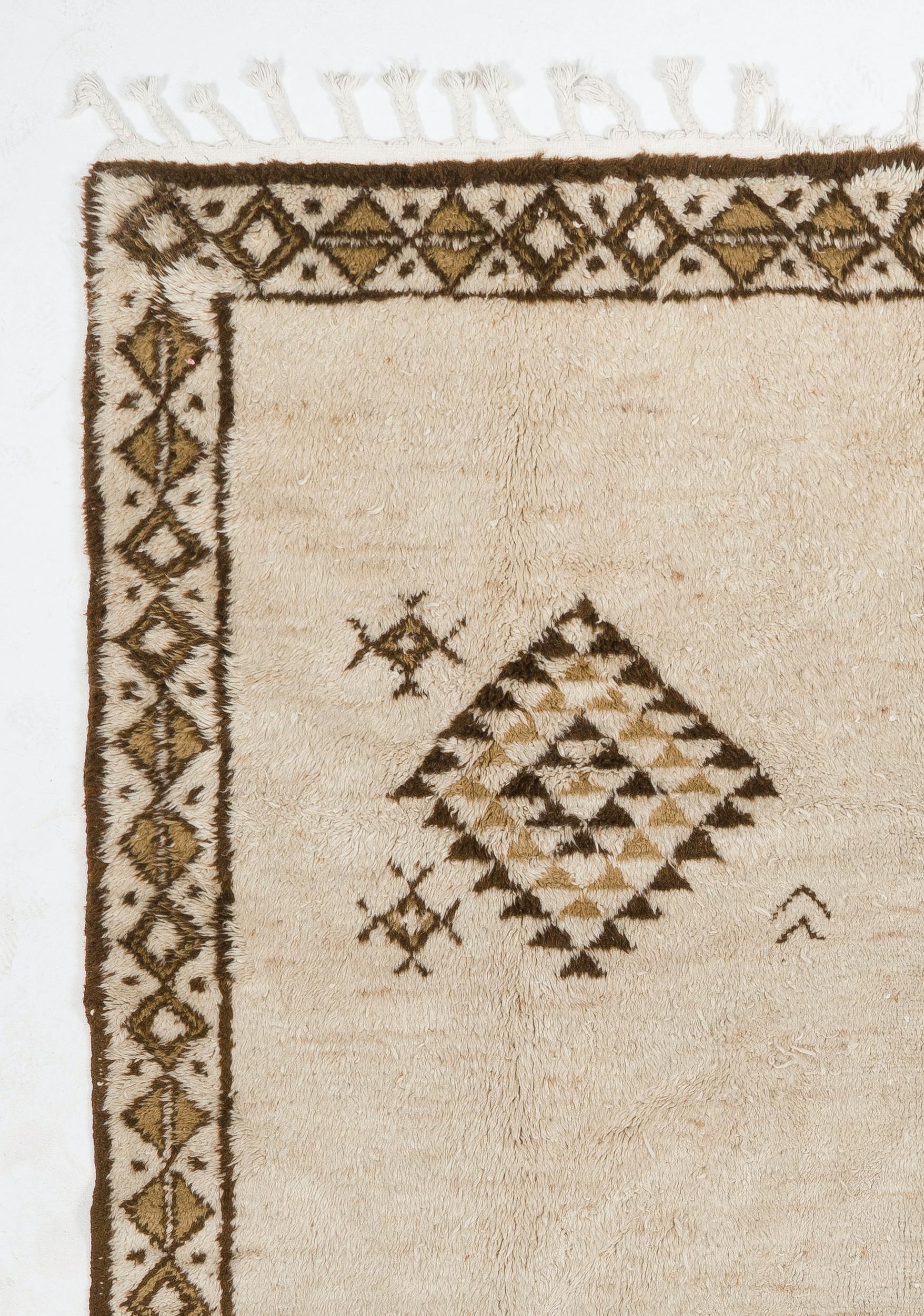 A vintage handmade Central Anatolian “Tulu” rug made of natural un-dyed sheep wool. Measures: 8 x 11 ft.

The rug is available as seen or if requested, it can be custom produced in a different size, color combination and design.