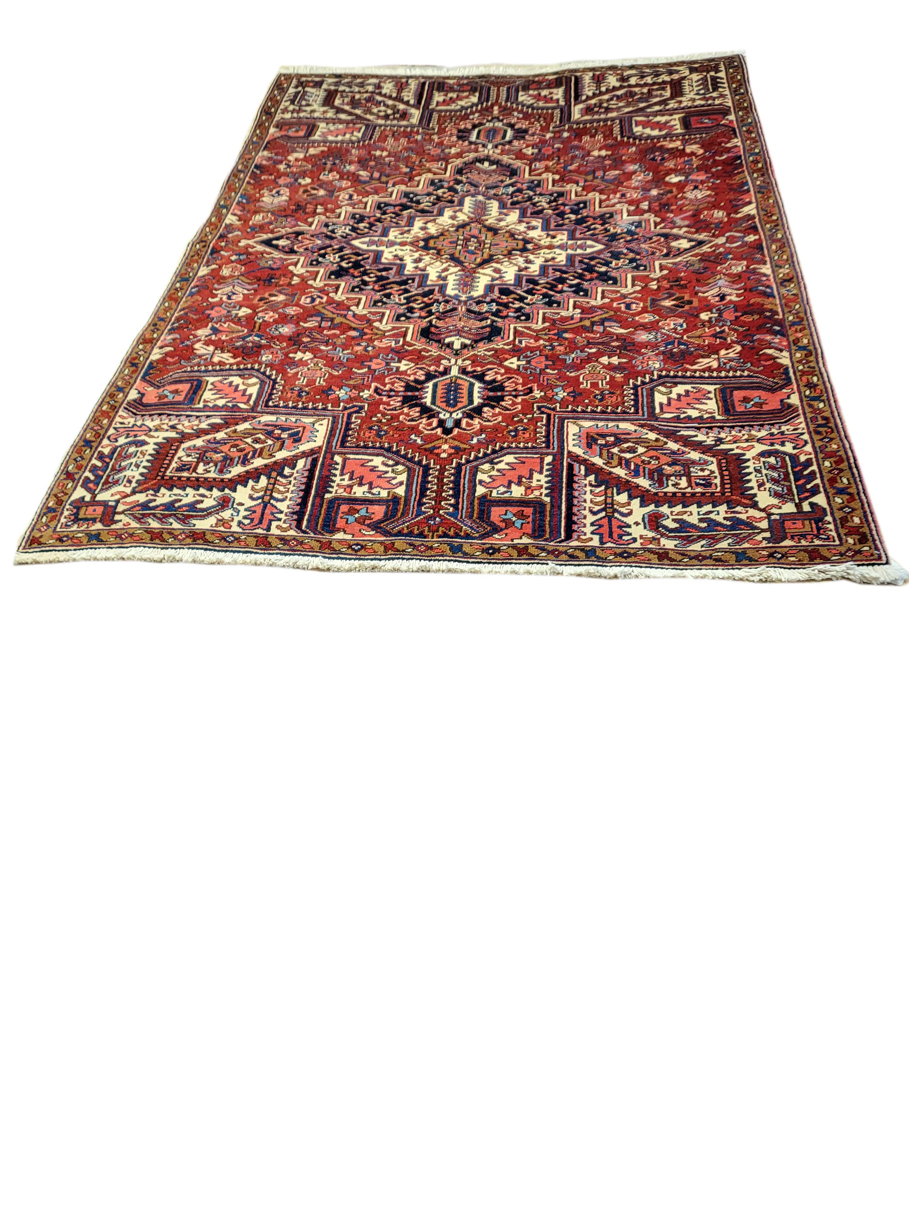 This jaw dropping, elaborate Heriz is a classic example of the bold Heriz design. With its luxuriously thick pile and expert craftsmanship, this near 80 year old rug will surely outlast us all! A one of a kind, authentic piece like this is