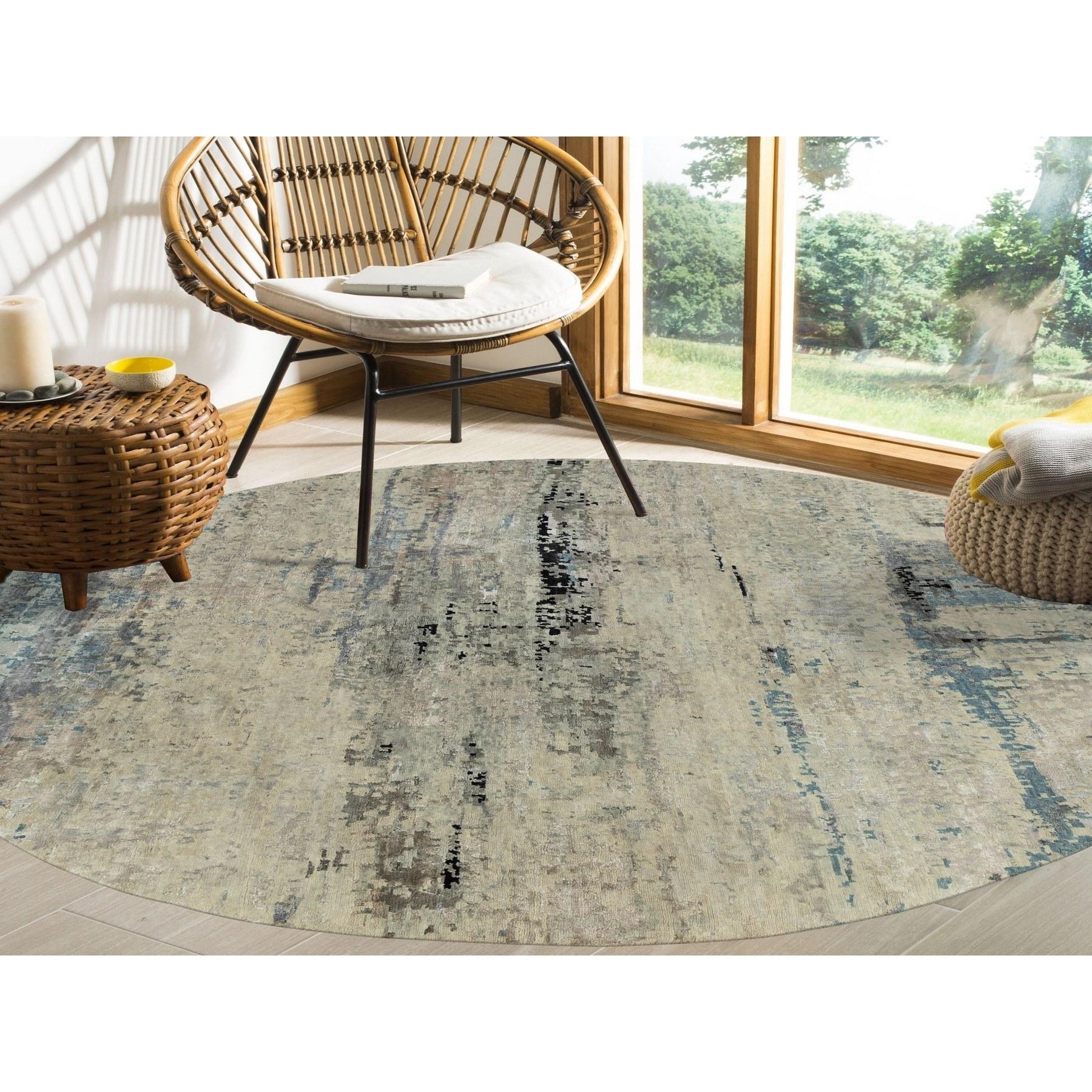 This is a truly genuine one-of-a-kind Abstract Design Silver-Blue Modern Hand Knotted Wool & Silk Oriental Round Rug. It has been Knotted for months and months in the centuries-old weaving craftsmanship techniques by expert artisans.
Primary
