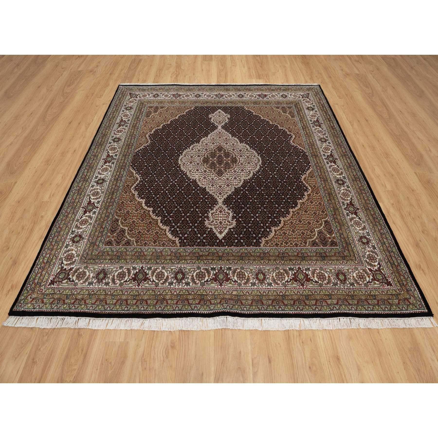 Premium Black, Tabriz Mahi with Fish Medallion Design, 100% Wool, Hand Knotted, 175 KPSI, Square, Oriental Rug
Primary materials: Wool
Latex: No Pile 
height: 0.25 Inches
Style: Traditional
Primary color: Black
Secondary colors: Green, Brown, Red,
