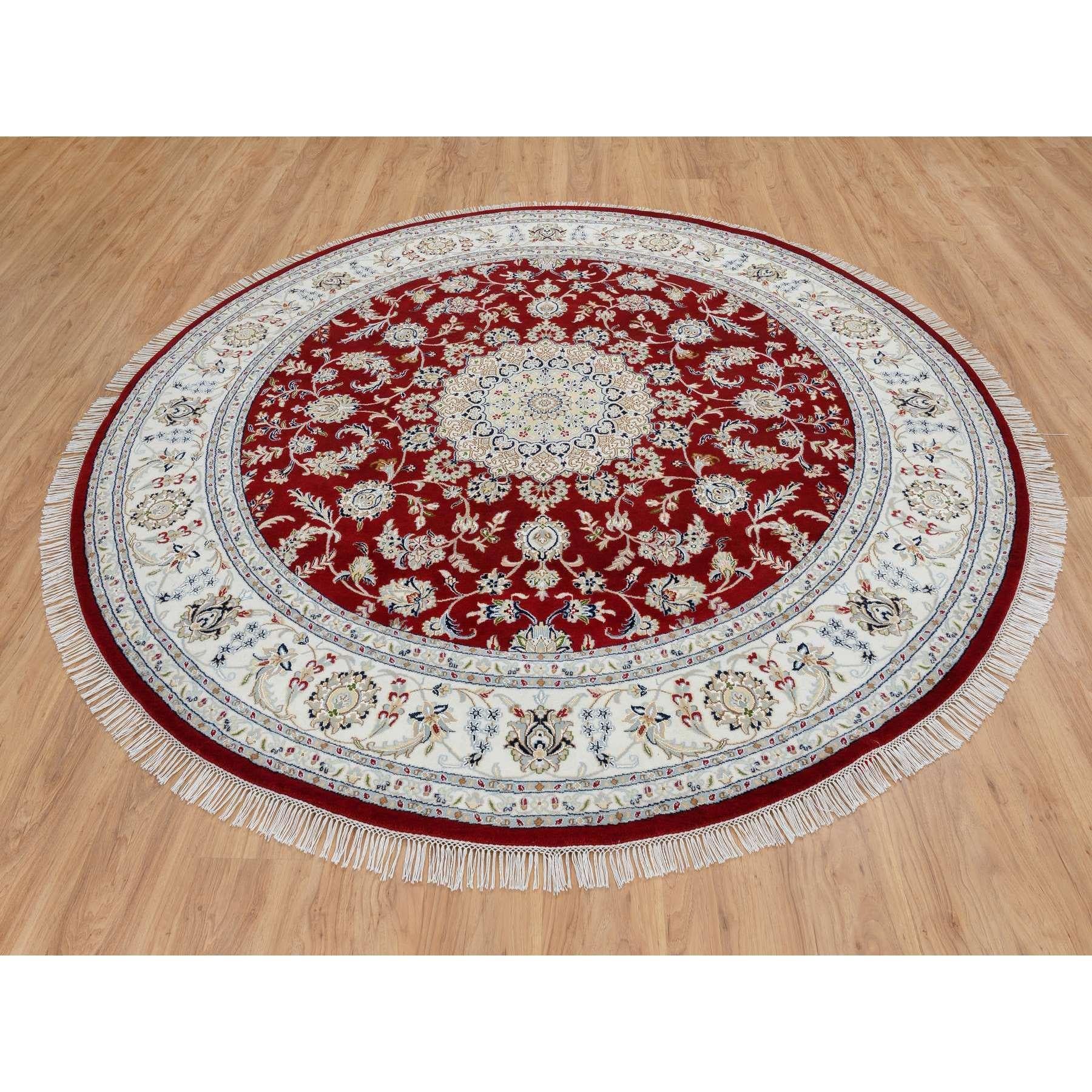 This is a truly genuine one-of-a-kind Cherry Red, Wool Hand Knotted, Nain with Center Medallion Flower Design 250 KPSI, Round Oriental Rug. It has been Knotted for months and months in the centuries-old weaving craftsmanship techniques by expert