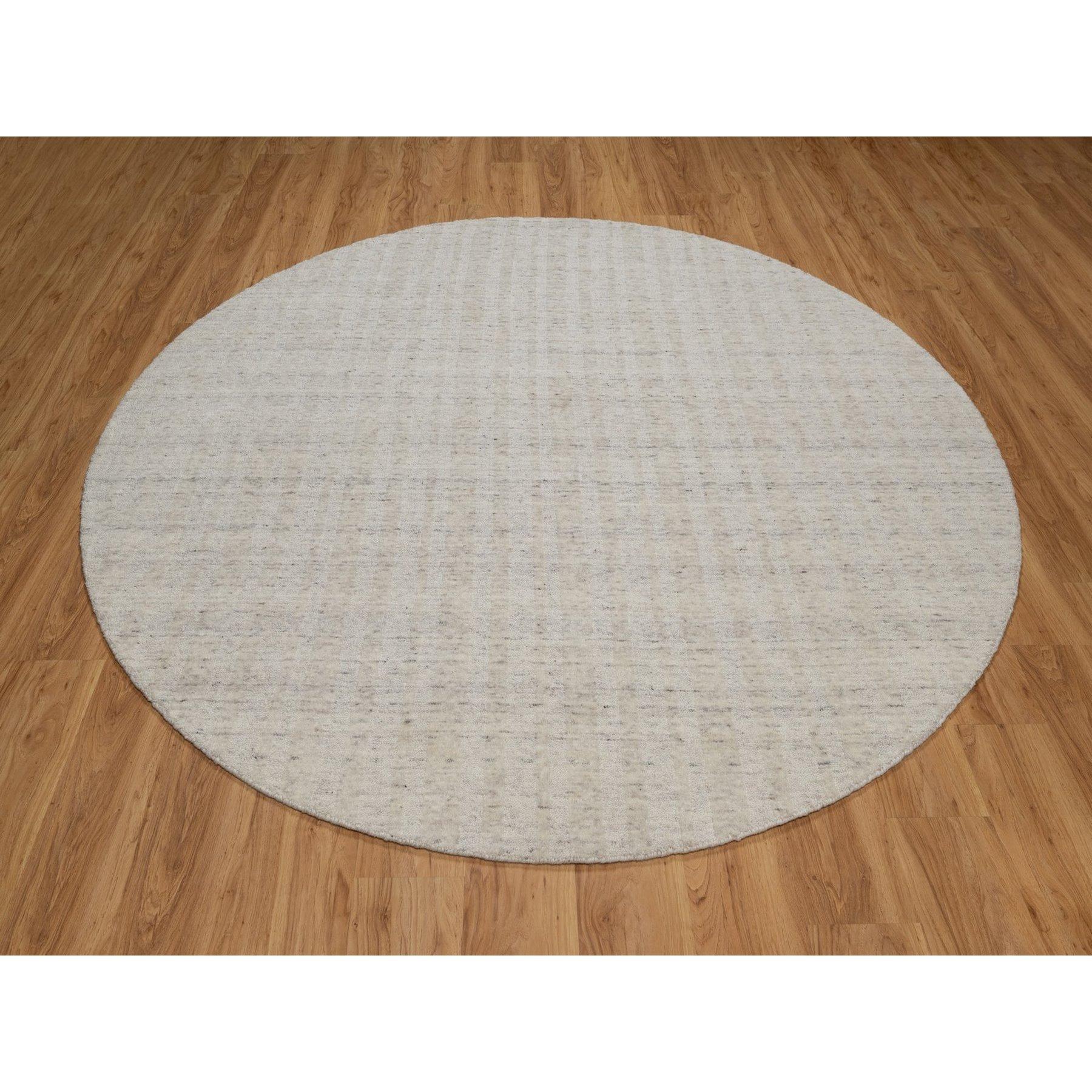 Chiffon White, Undyed Natural Wool, Vertical Stripes Design with Salt and Pepper Effect, Hand Loomed, Round, Oriental Rug
Primary materials: Wool
Latex: No Pile 
height: 0.25 Inches
Style: Contemporary
Primary color: Ivory
Secondary colors: