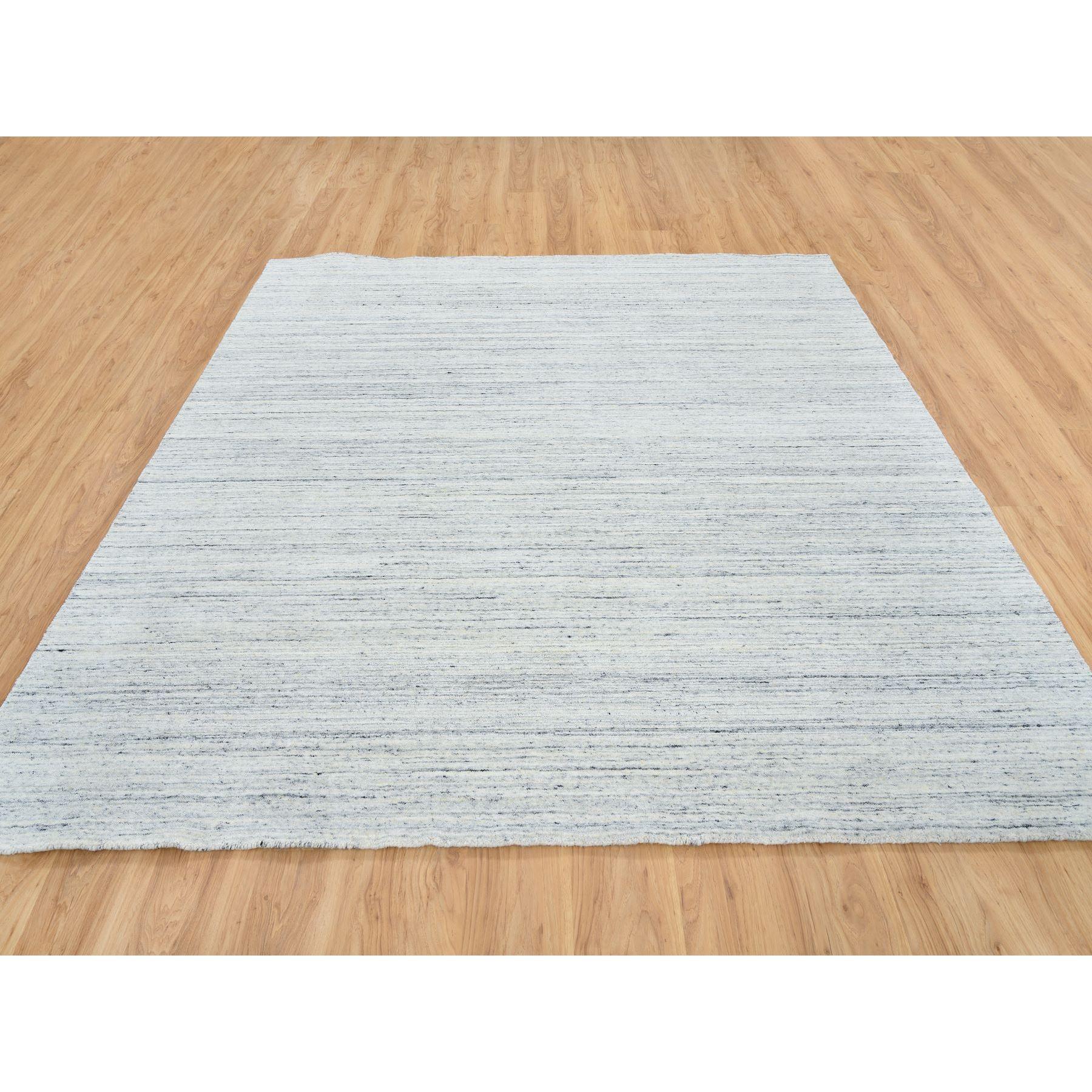 This is a truly genuine one-of-a-kind Ivory, Plain Modern Striae Design Soft Pile, Soft Wool Hand Loomed, Square Oriental Rug. It has been Loomed for months and months in the centuries-old weaving craftsmanship techniques by expert artisans.
Primary