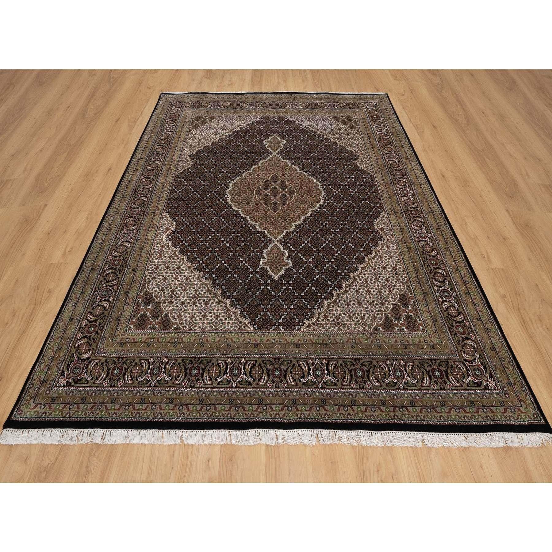 Premium Black, Hand Knotted, 175 KPSI, Tabriz Mahi with Fish Medallion Design, 100% Wool, Oriental Rug 
Primary materials: Wool
Latex: No Pile 
height: 0.25 Inches
Style: Traditional
Primary color: Black
Secondary colors: Ivory, Red, Brown,