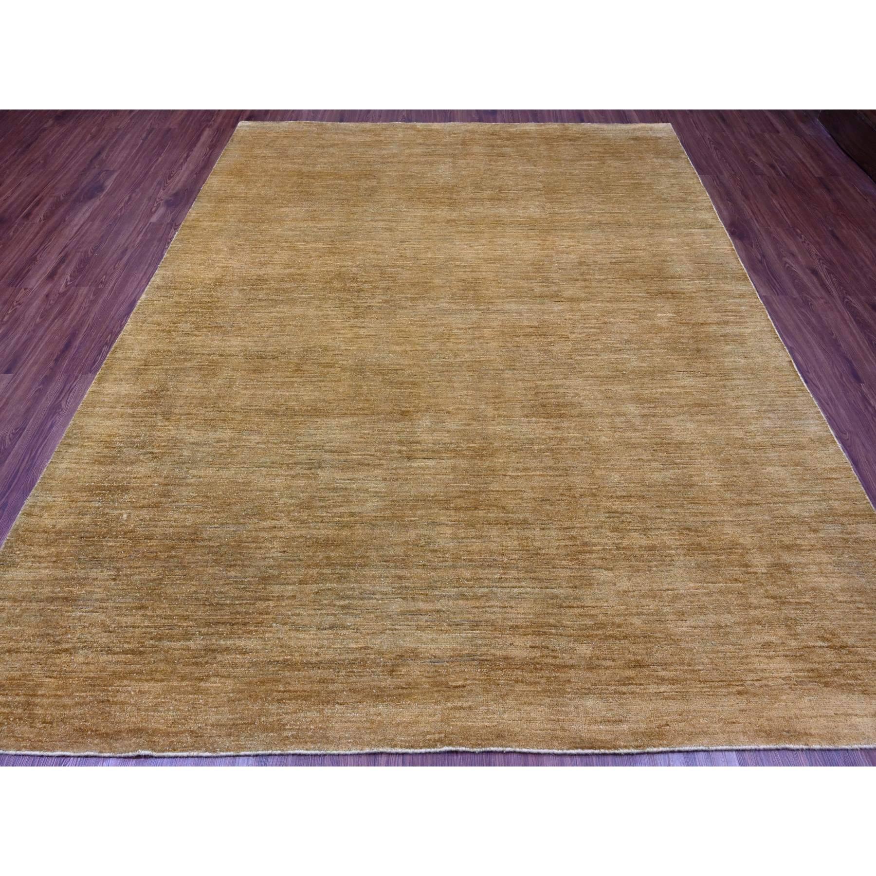 Honey Brown, Plain Solid Pattern, Hand Knotted, Hand Spun Ghazni Wool, Lush and Plush, Oriental Rug
Primary materials: Wool
Latex: No Pile 
height: 0.25 Inches
Style: Contemporary
Primary color: Brown
Secondary colors: None
Pattern: Oriental